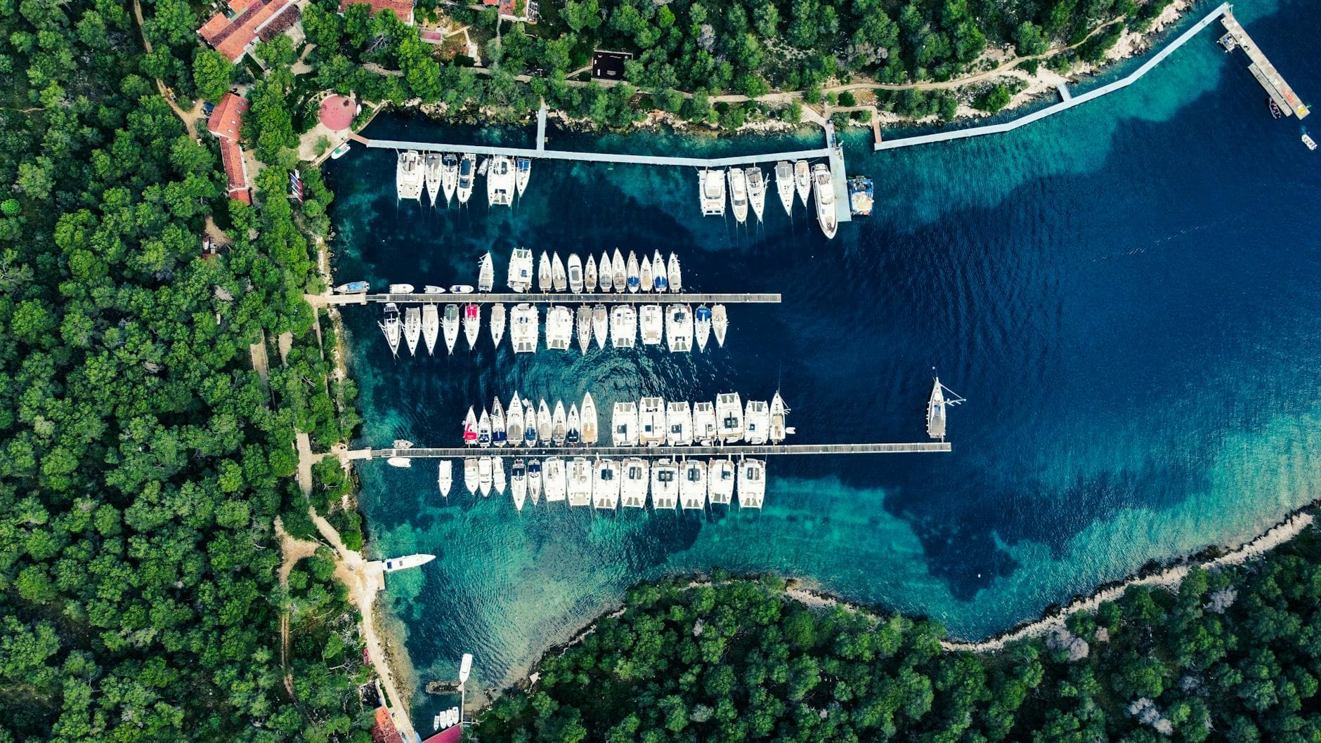 Stunning aerial shot of a marina with yachts on the Croatian coast.