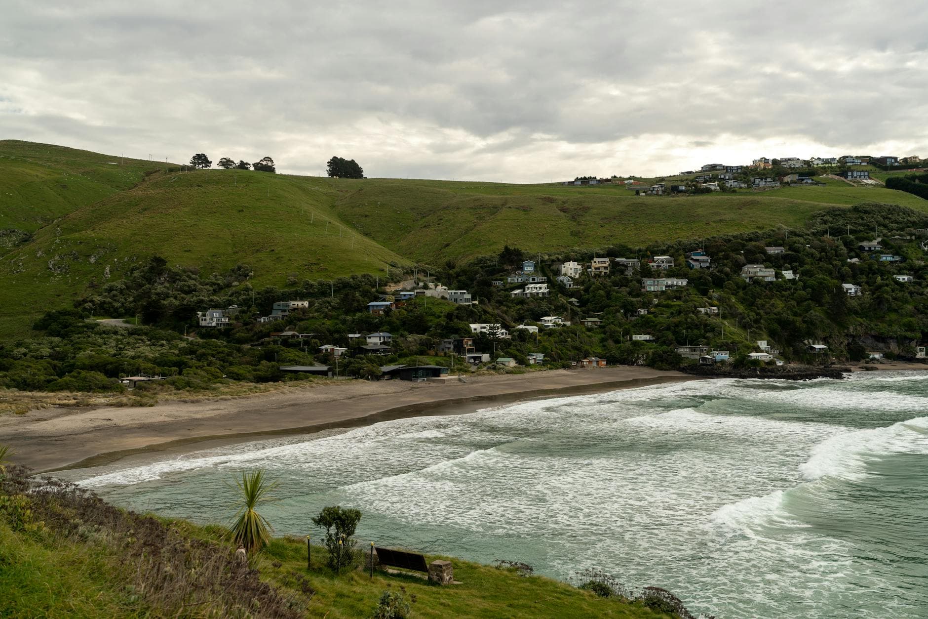 Stunning view of Christchurch's coastline featuring lush hills and a serene bay.