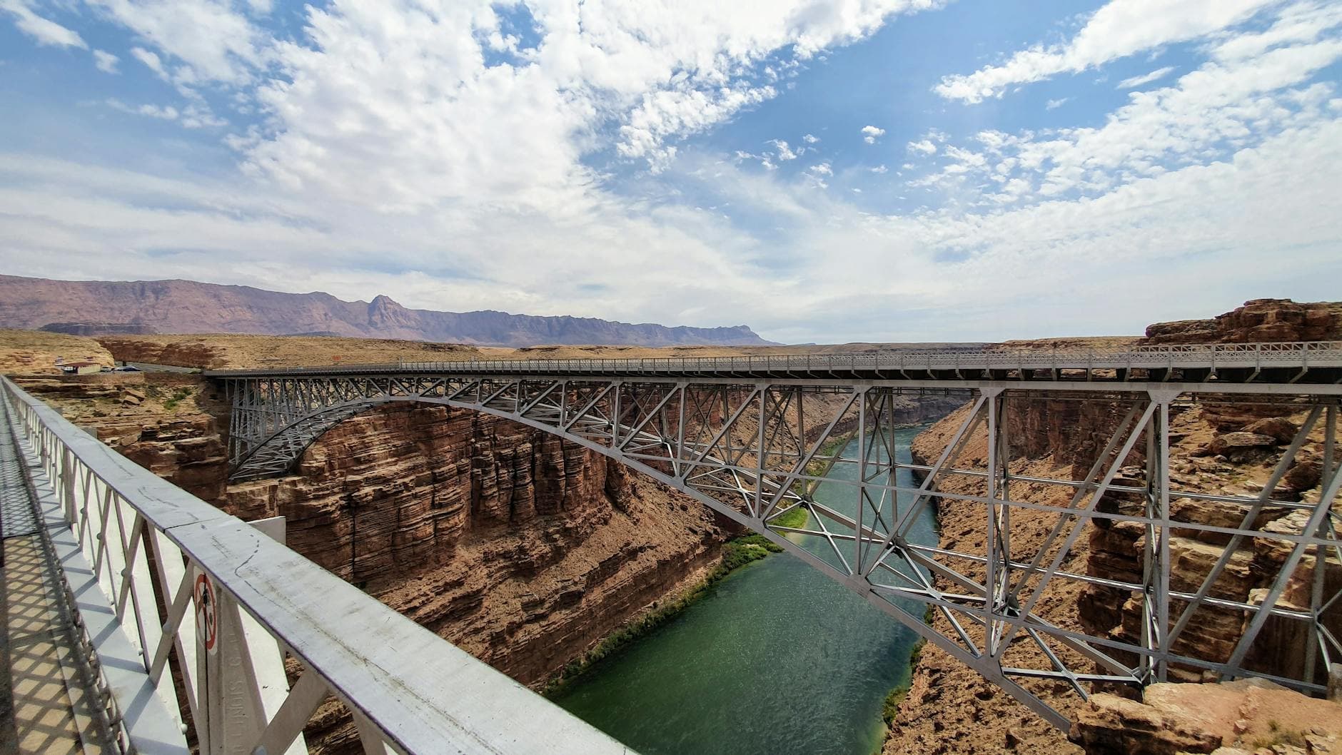 Dramatic view of Navajo Bridge over Colorado River in Marble Canyon, Arizona.
