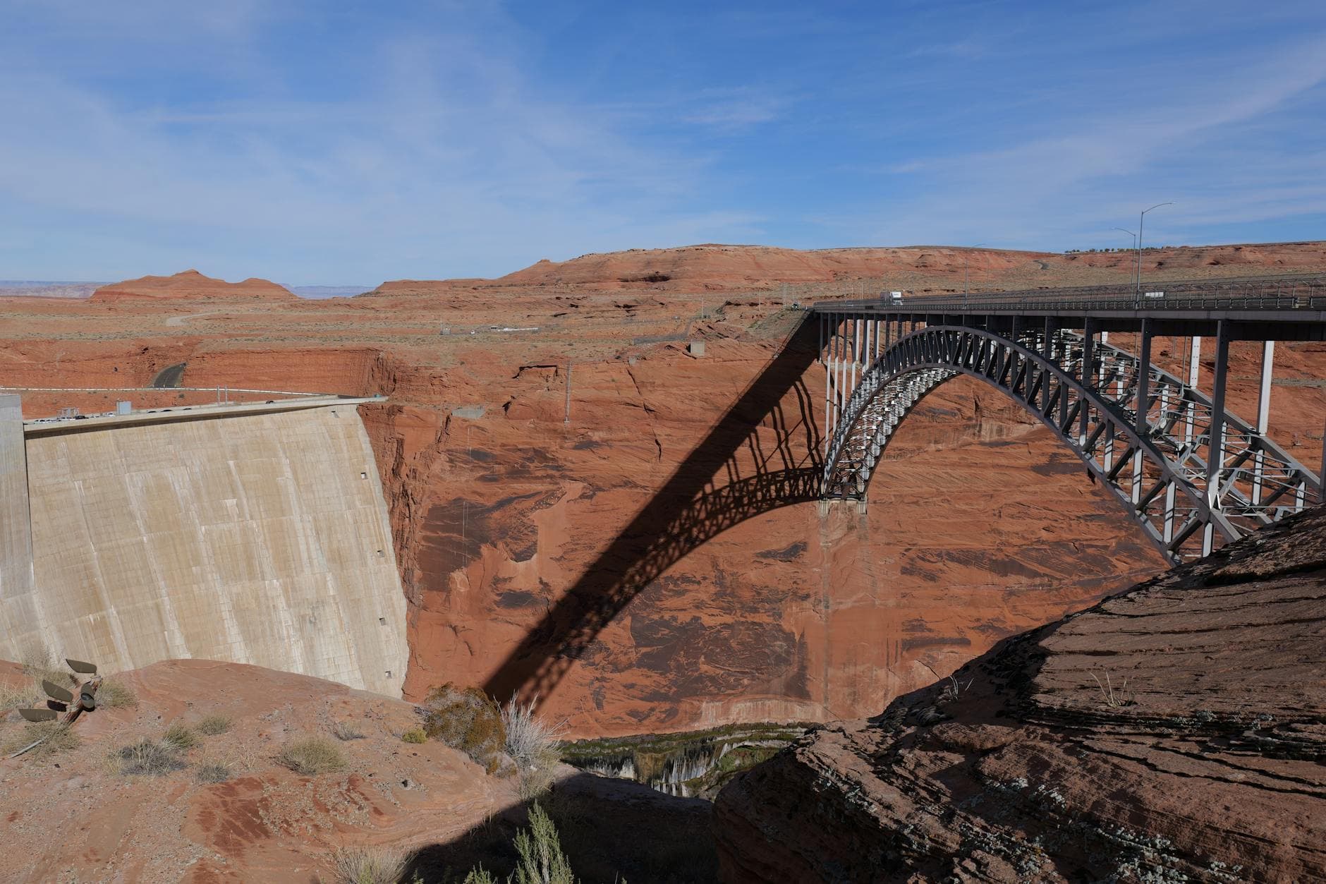 A scenic view of Glen Canyon Dam and arch bridge over Colorado River, Arizona.