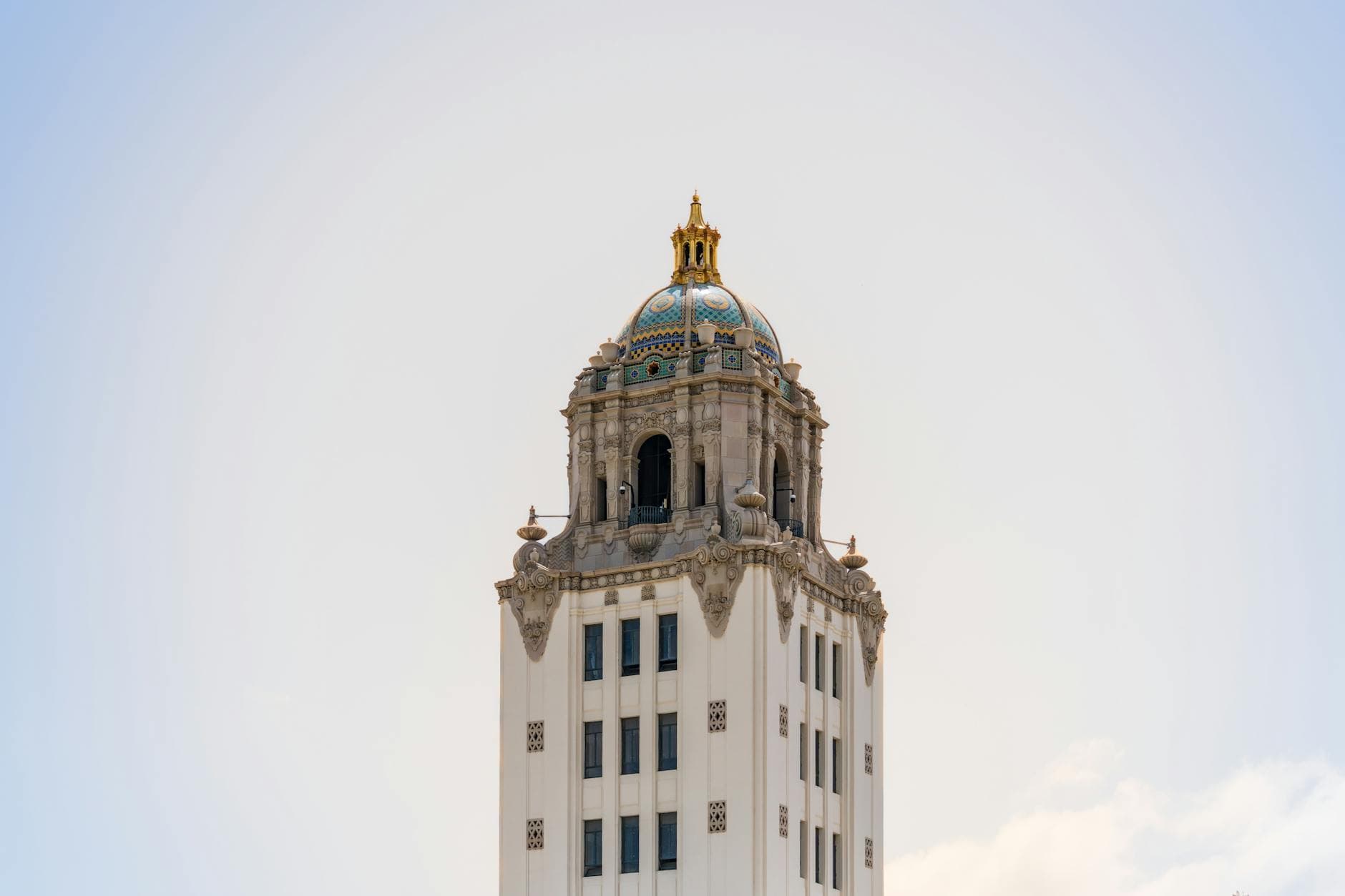 Captivating view of the iconic Beverly Hills City Hall tower under a clear blue sky.