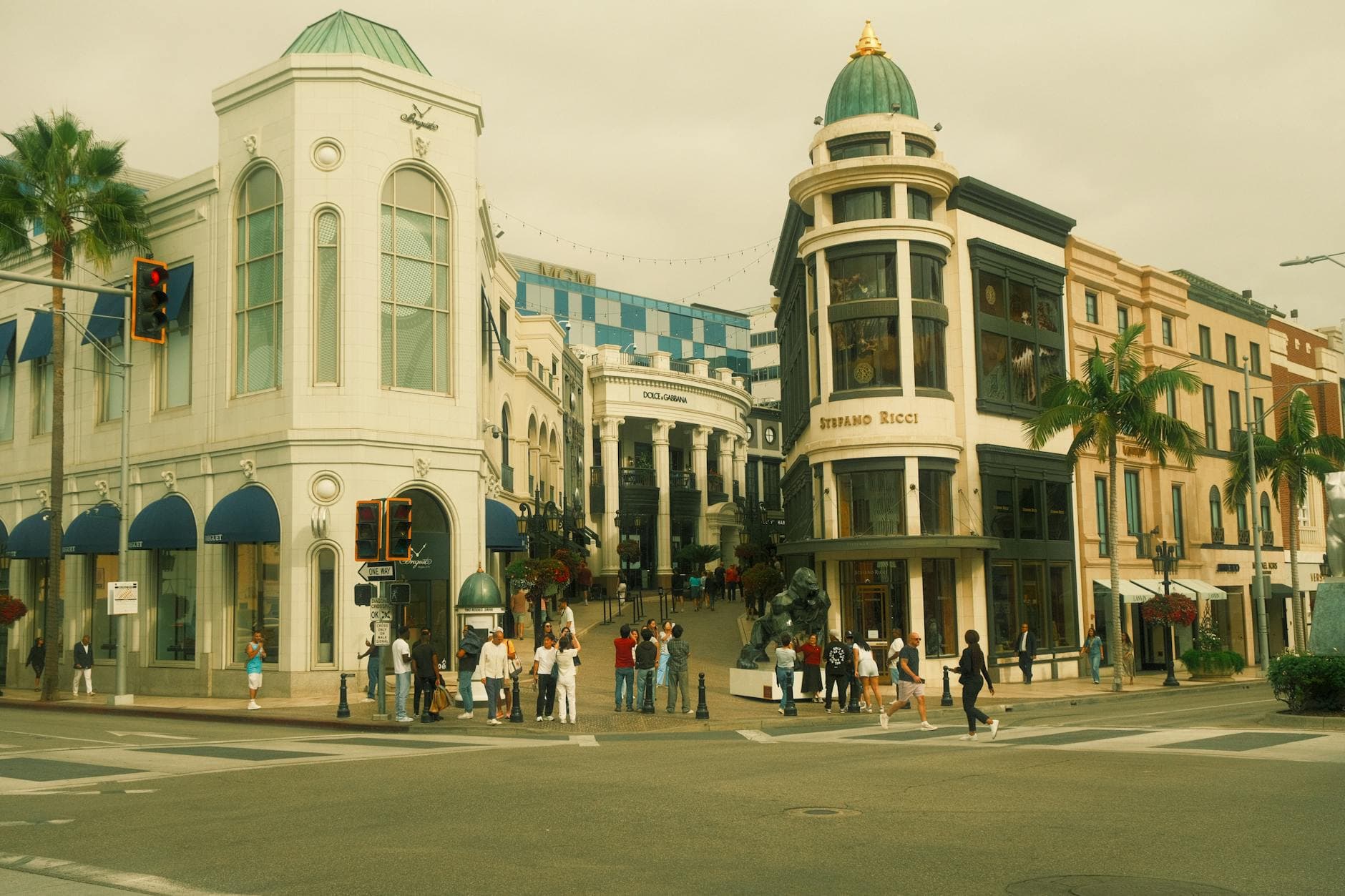 Vibrant street view of Rodeo Drive in Los Angeles with iconic architecture and lively urban atmosphere.