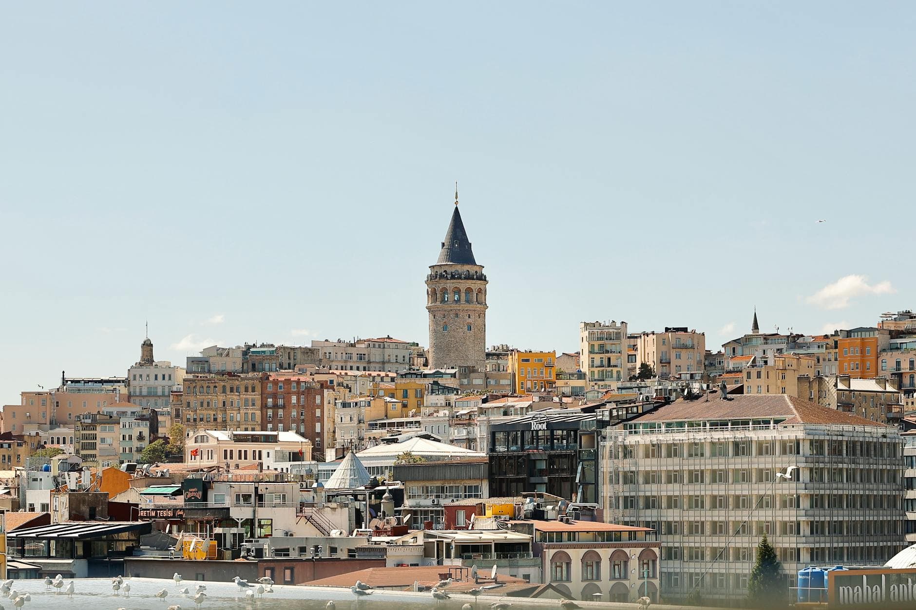 A breathtaking view of Istanbul featuring the iconic Galata Tower amidst a bustling urban skyline.