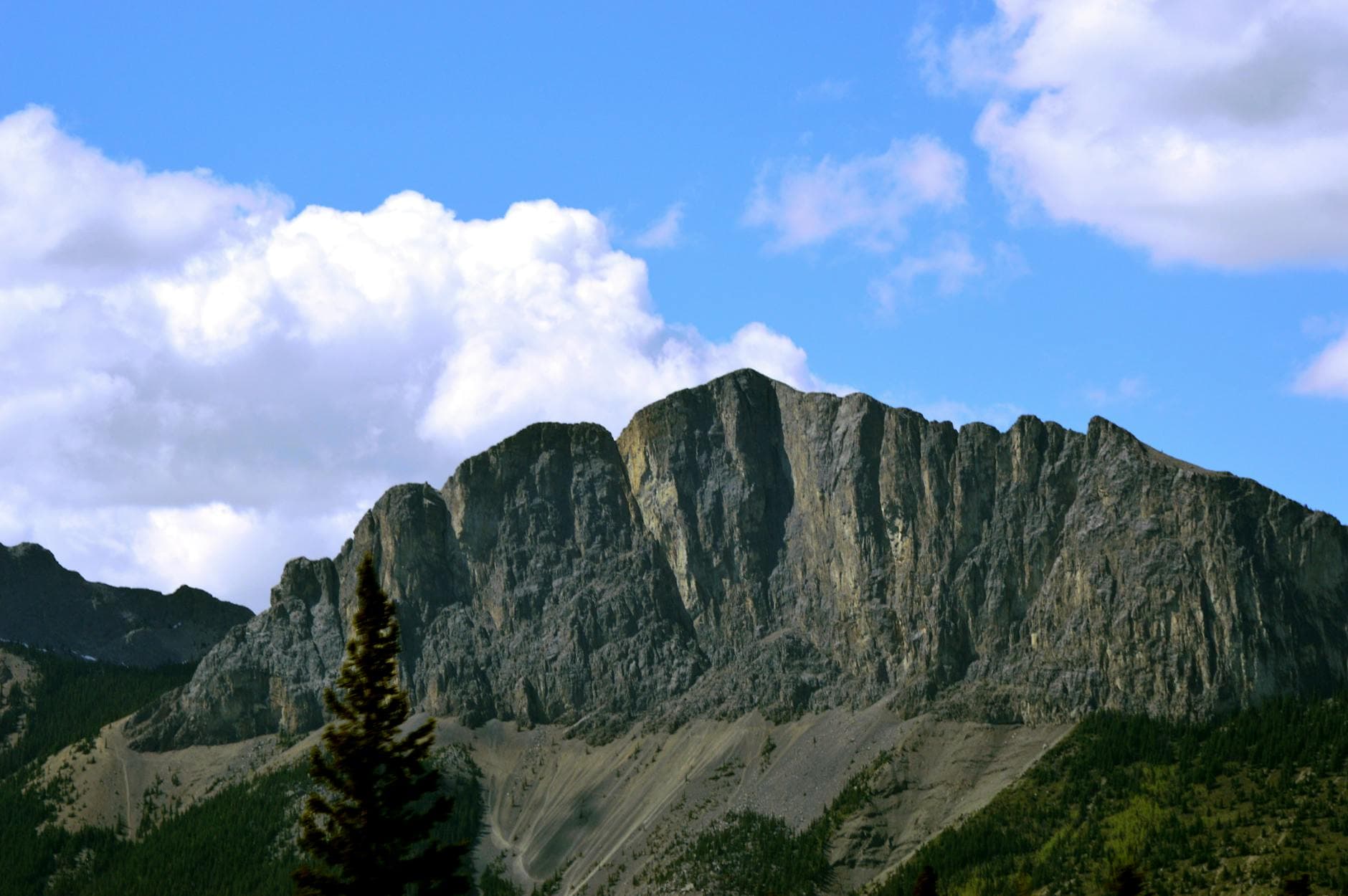 Stunning view of the Rocky Mountains under a blue sky in Golden, BC, Canada.