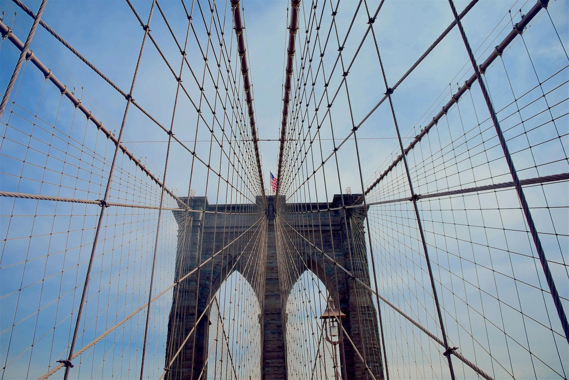 Low angle view of the Brooklyn Bridge cables and structure in New York City.