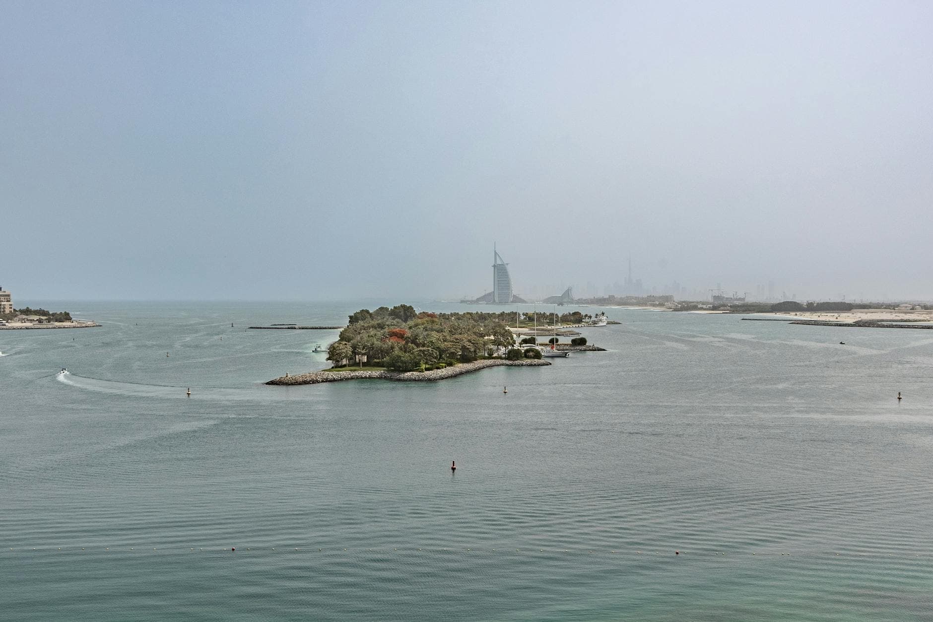 Scenic aerial view of Dubai with Burj Al Arab and surrounding coastline.