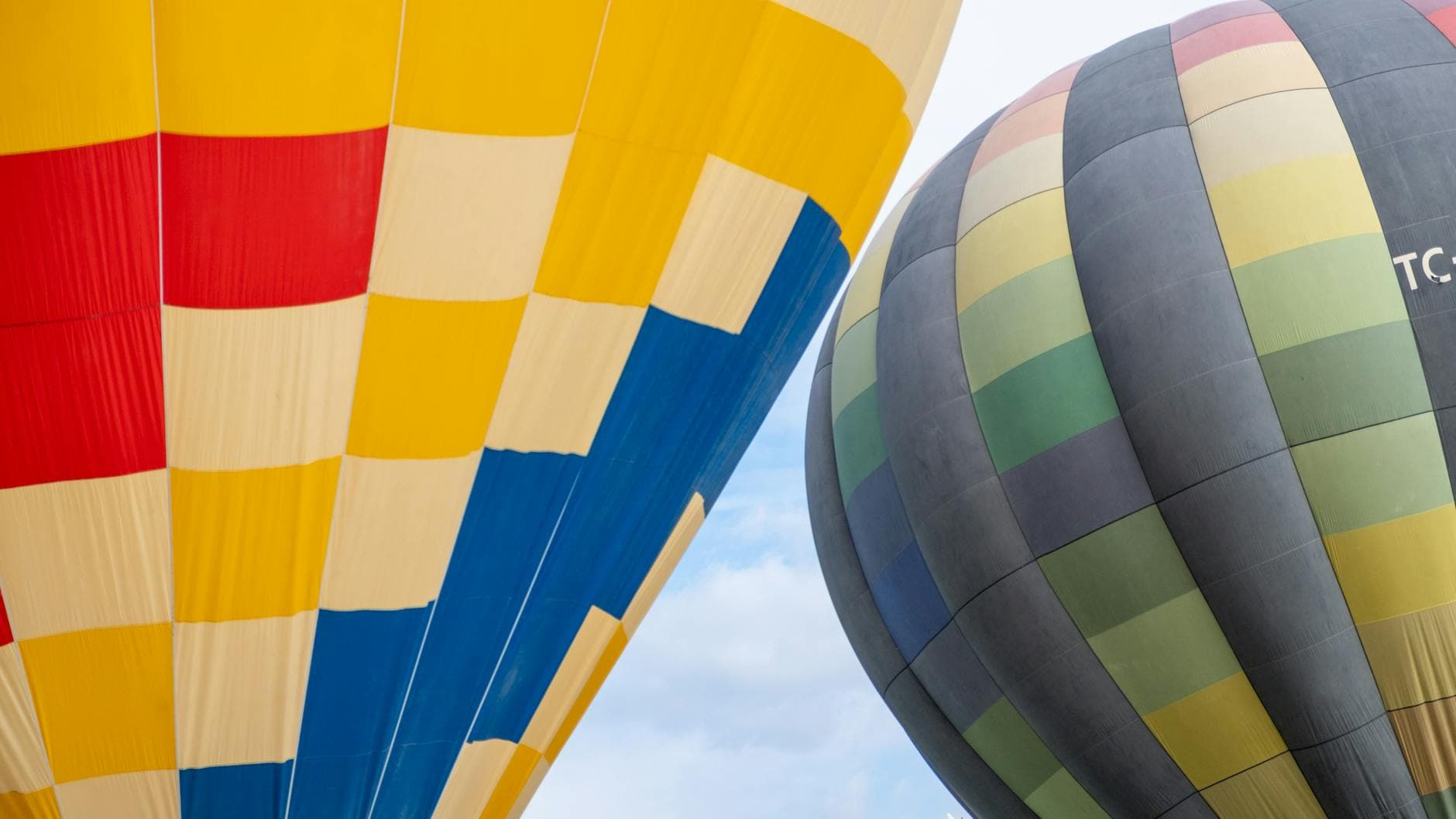 Vibrant hot air balloons soar in Burdur, Türkiye, offering a scenic aerial adventure.