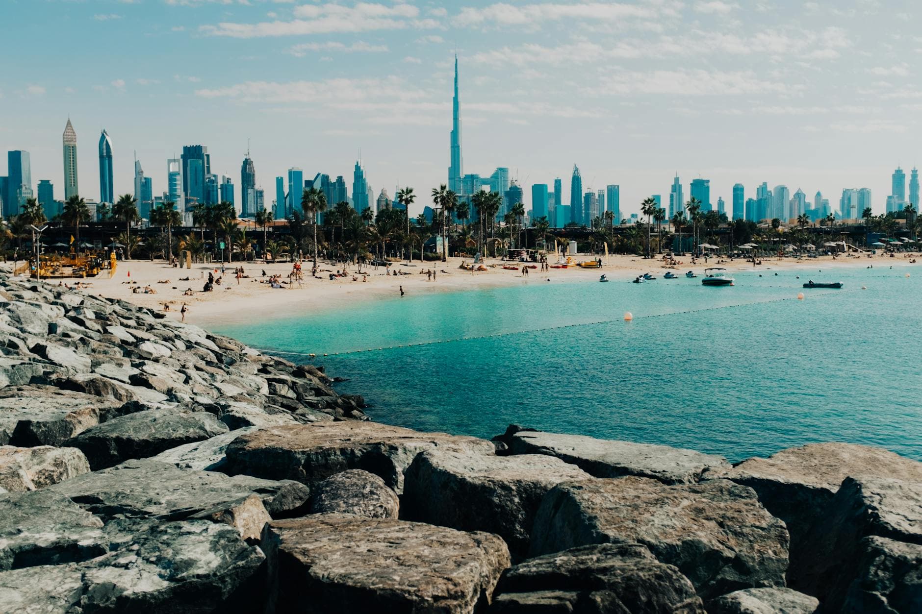 Stunning view of Dubai's beach and skyline with the iconic Burj Khalifa.
