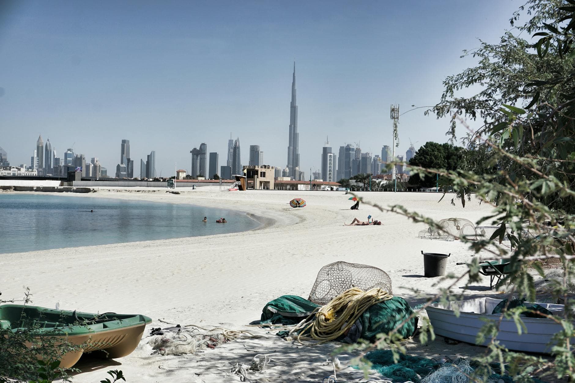 Scenic view of Dubai's skyline with the iconic Burj Khalifa from a serene beach setting.