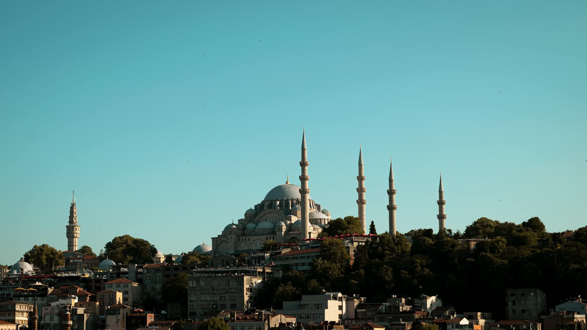Beautiful view of Suleymaniye Mosque with minarets against a clear blue sky in Istanbul, Turkey.