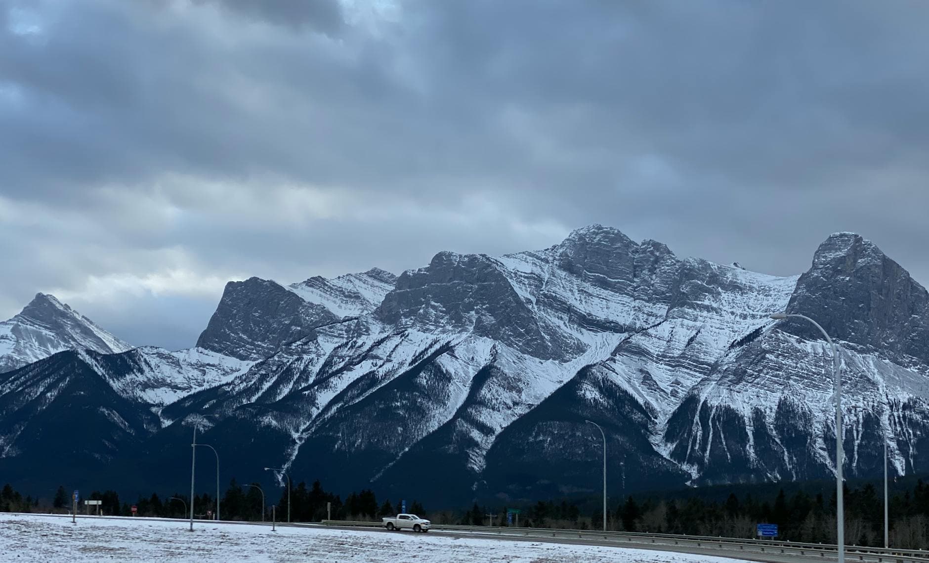 Stunning winter view of snow-capped Rocky Mountains in Canmore, Alberta, Canada.