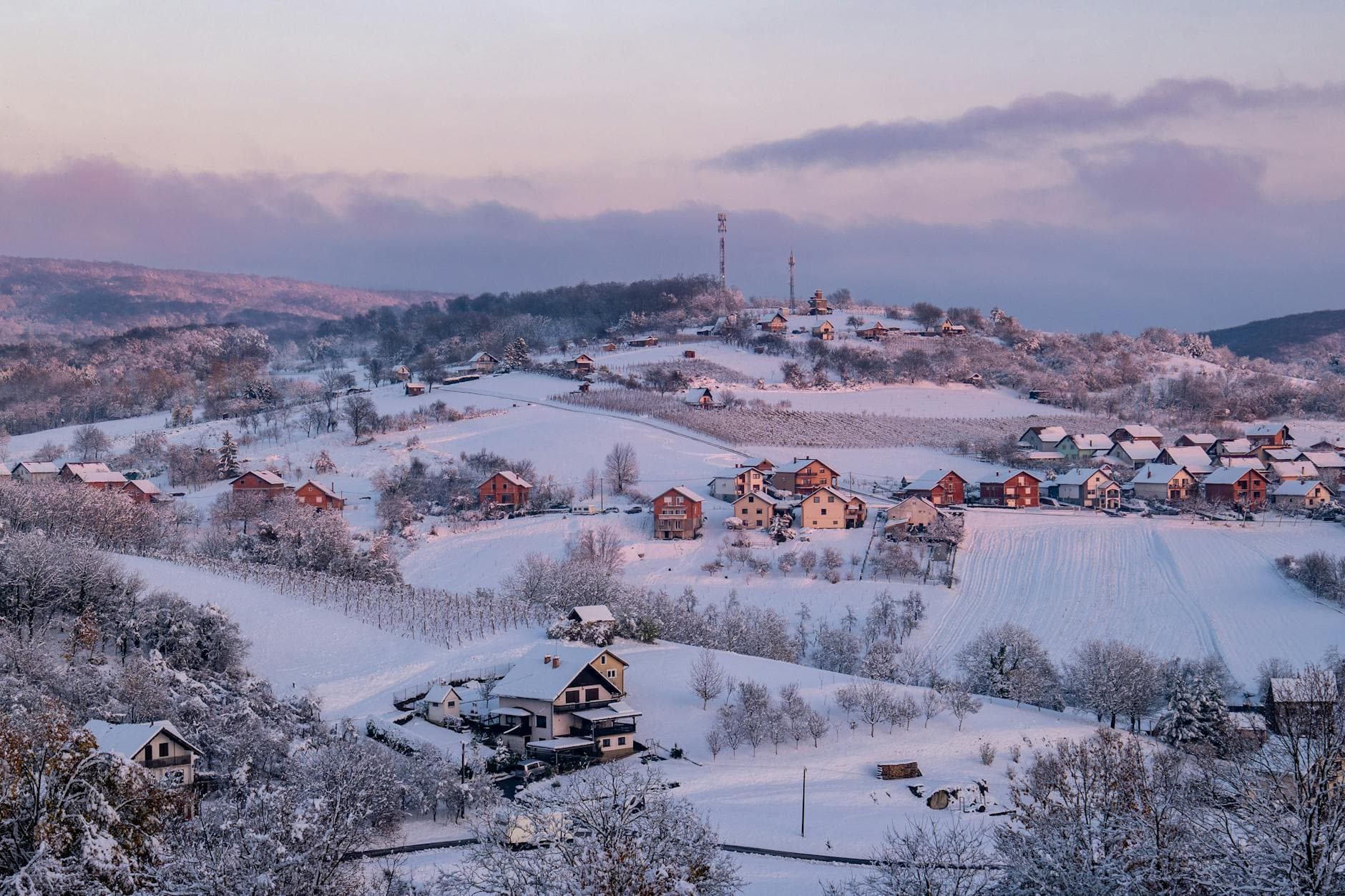 Beautiful snowy hillside view of Daruvar at twilight, capturing serene winter charm.