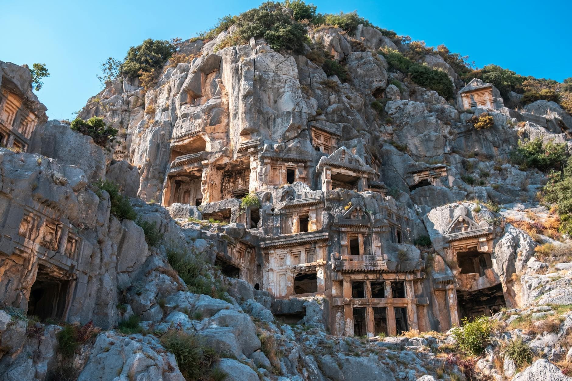 Explore the ancient rock-cut tombs of Myra in Demre, Türkiye, a historical landmark.