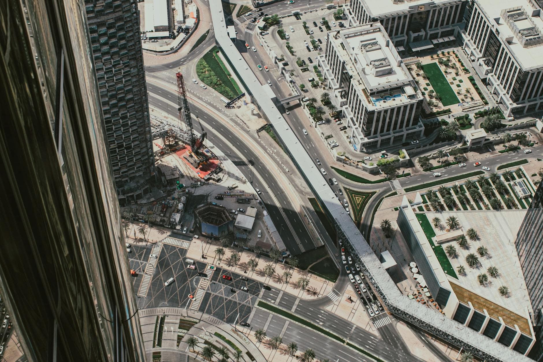 Overhead capture of Dubai's bustling downtown showcasing roads and modern buildings.