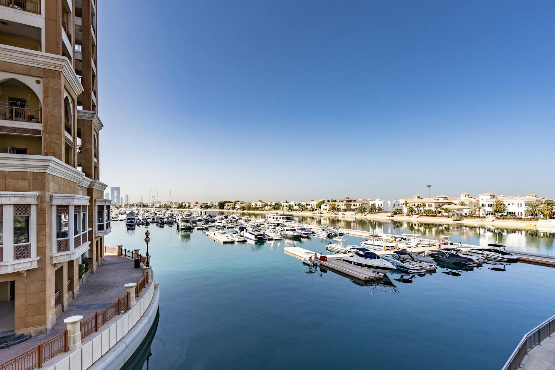 Explore this stunning view of Dubai's marina with luxurious yachts and modern architecture.