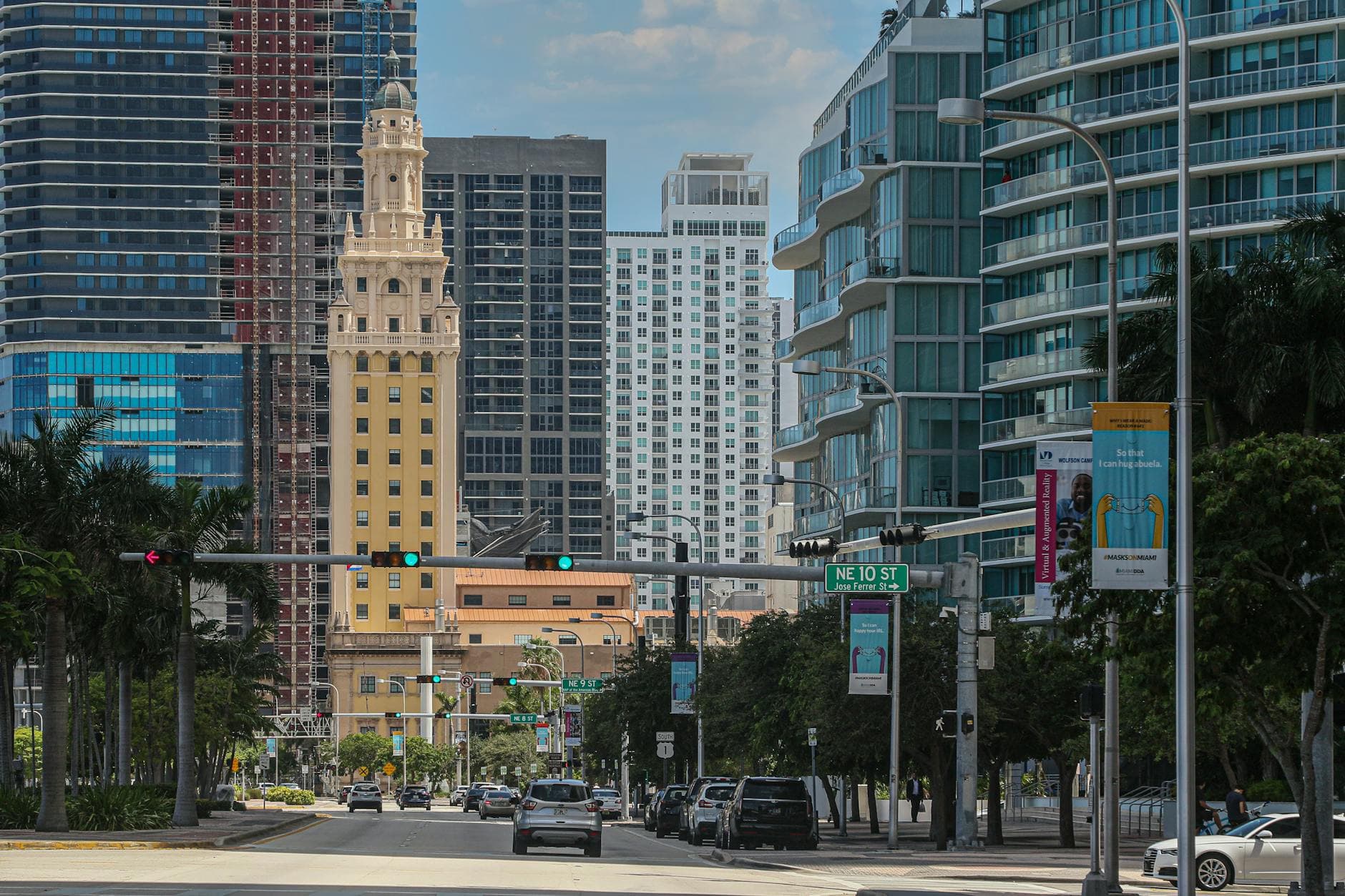 Vibrant view of downtown Miami featuring iconic skyscrapers and busy street life.