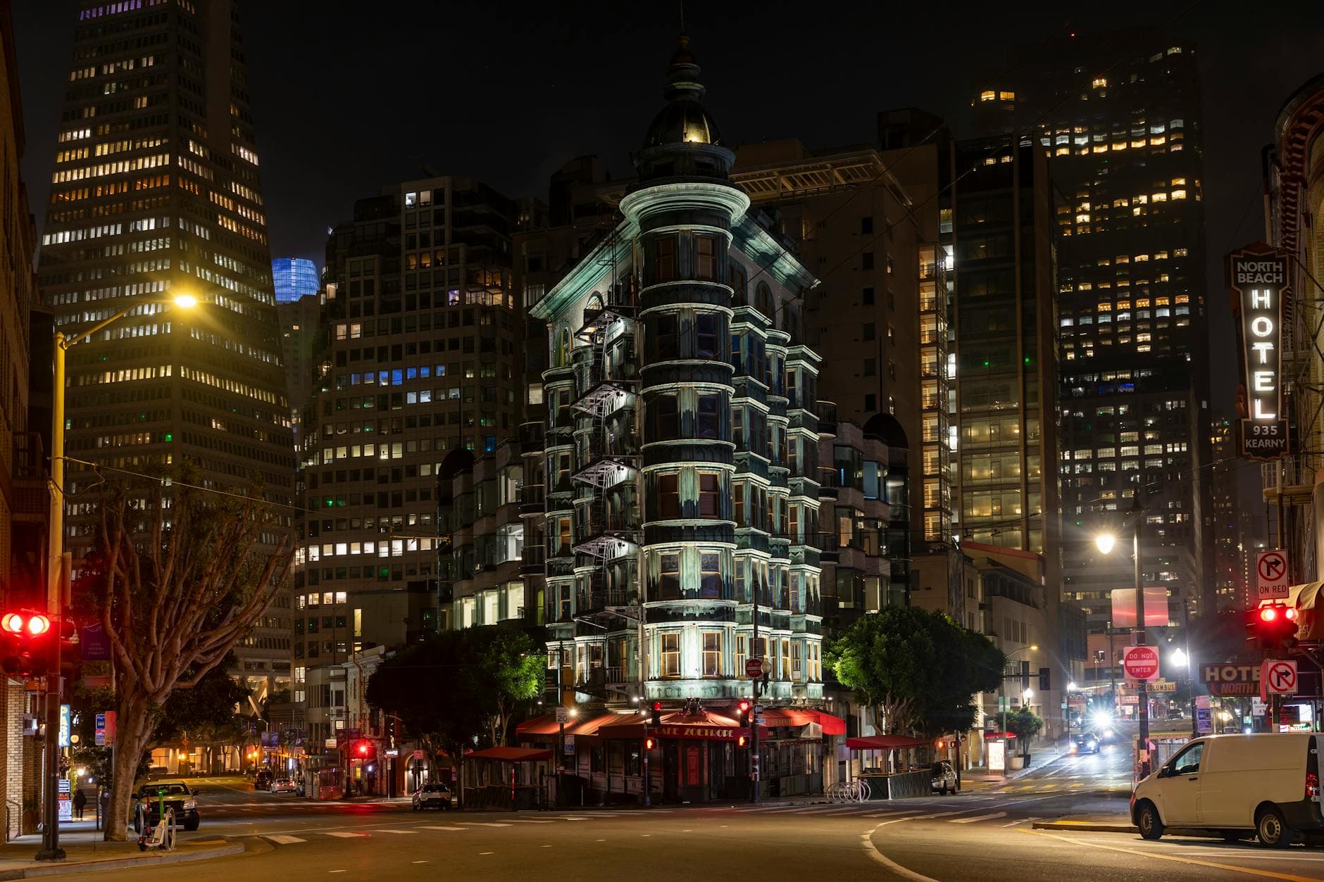 Dramatic nighttime scene of a historic building in San Francisco's cityscape.