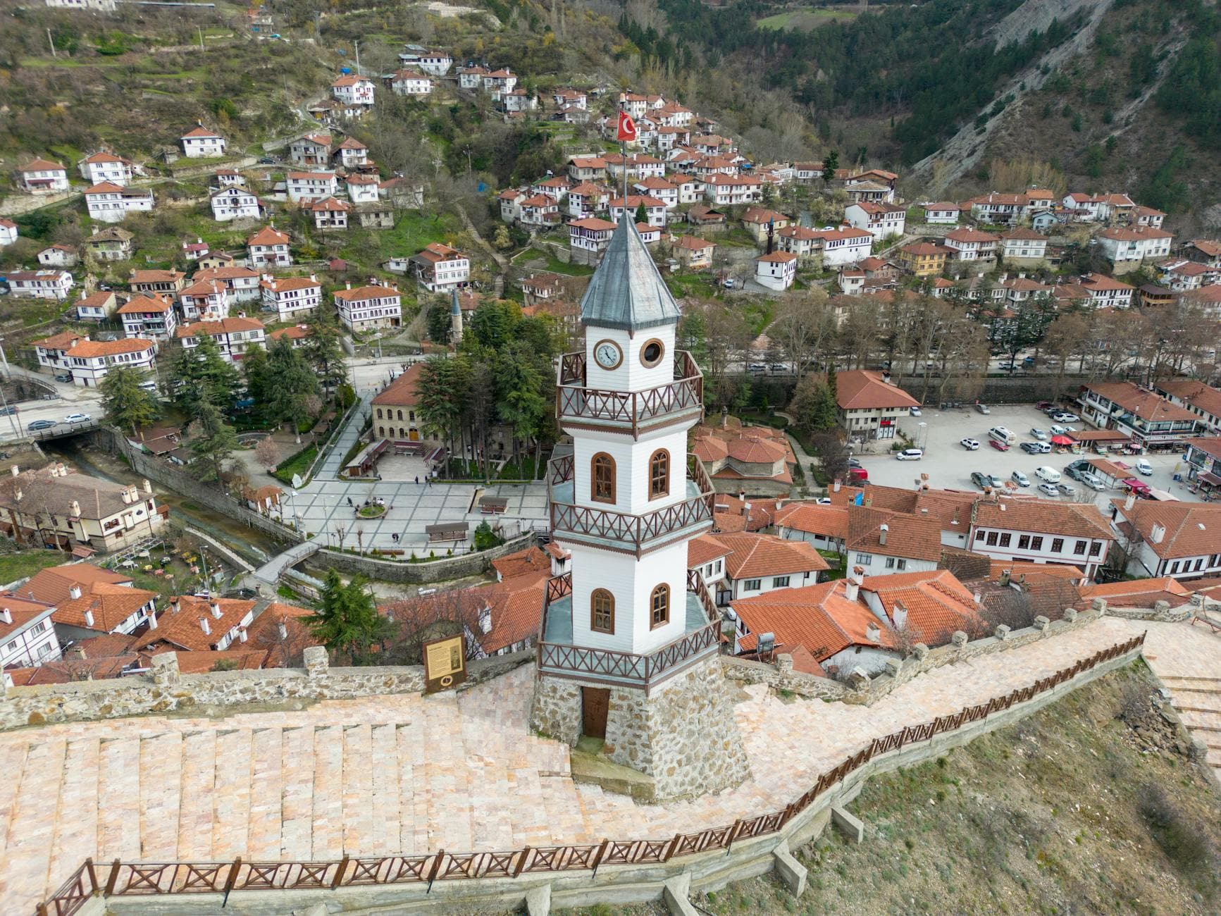 A stunning aerial view of Göynük, Turkey, featuring the iconic Victory Tower amidst a charming townscape.