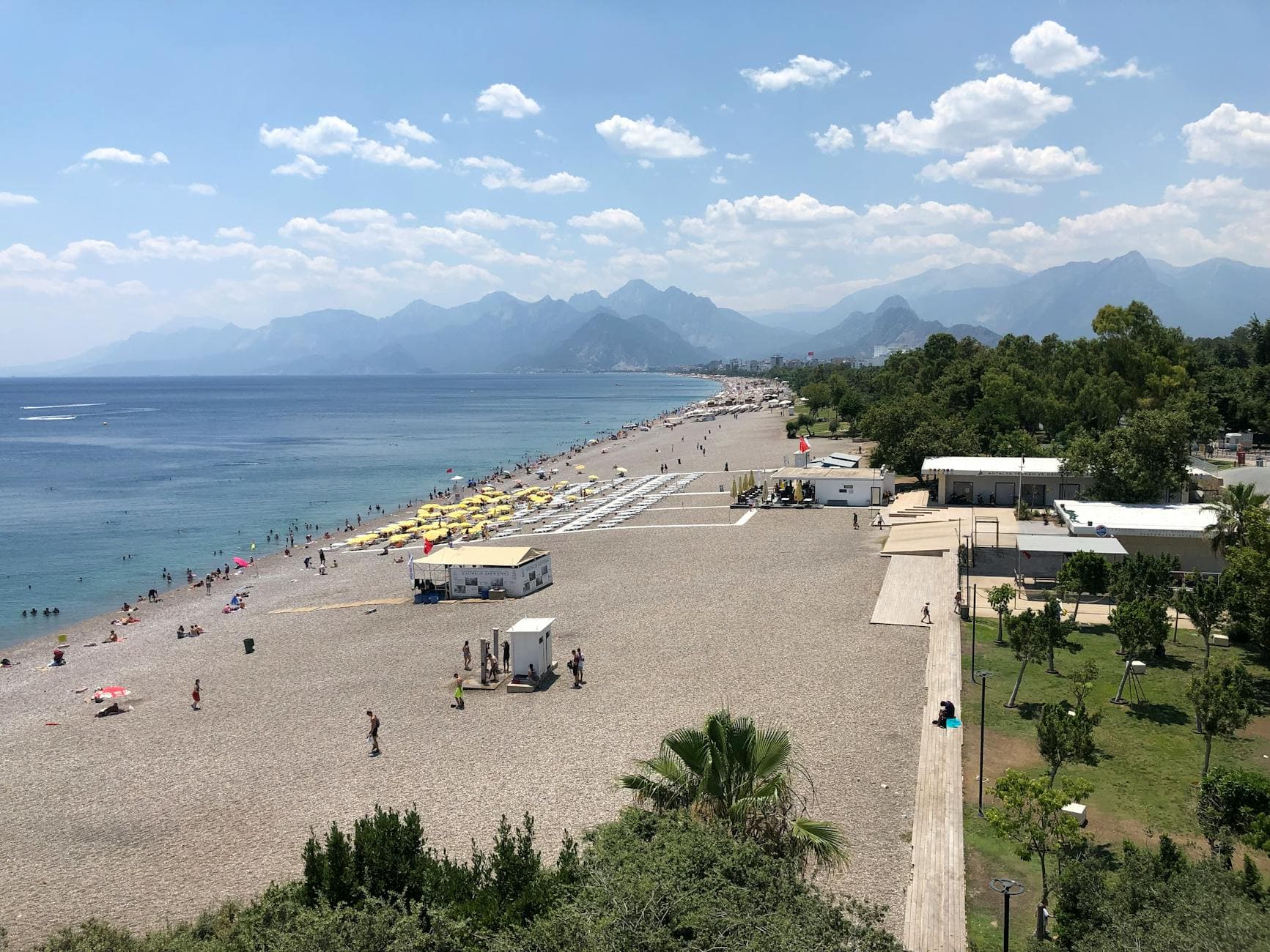 Scenic aerial view of Konyaaltı Beach in Antalya, Turkey, on a sunny summer day.