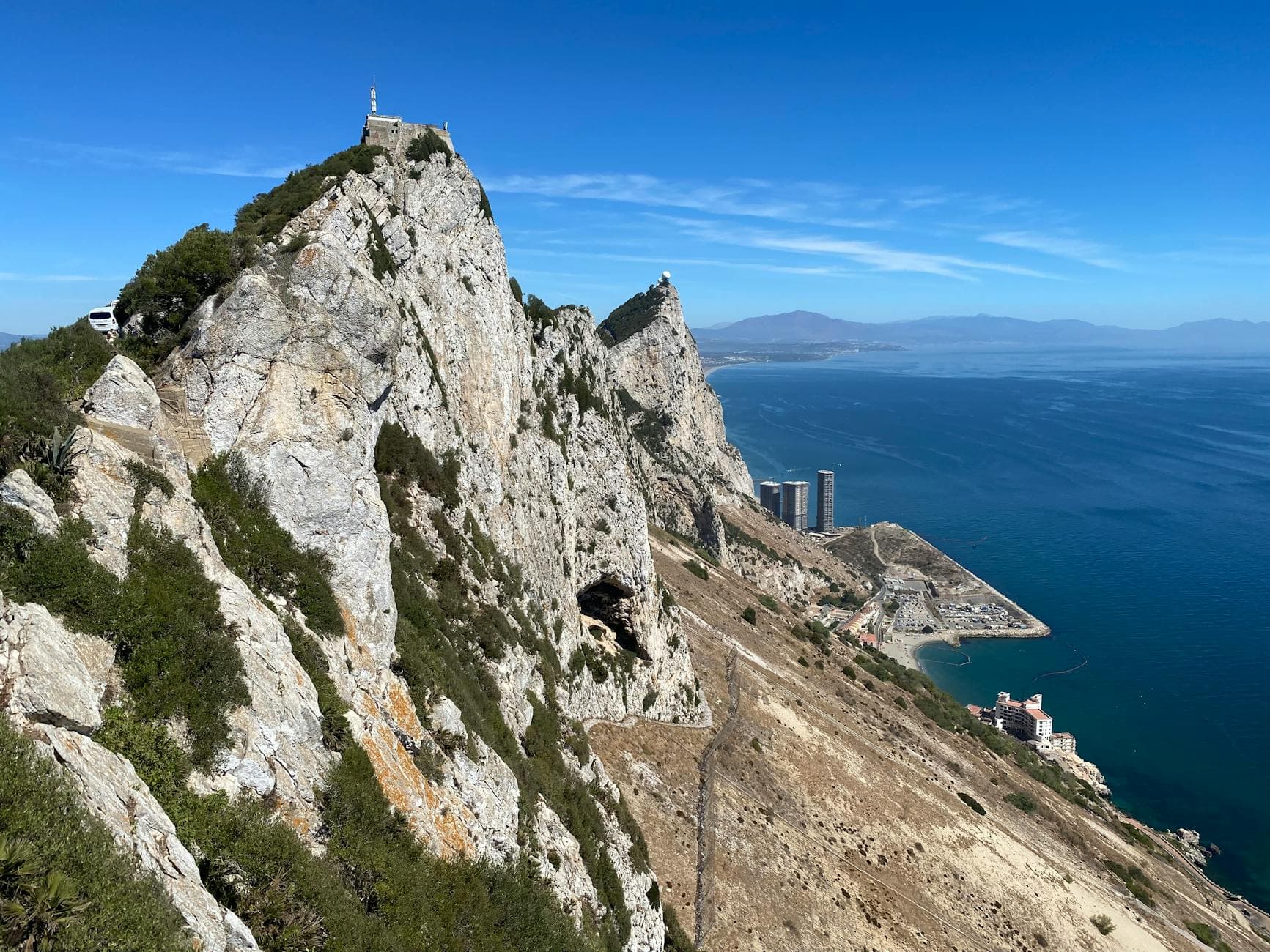 Stunning aerial view of the Rock of Gibraltar overlooking the Mediterranean Sea on a clear day.
