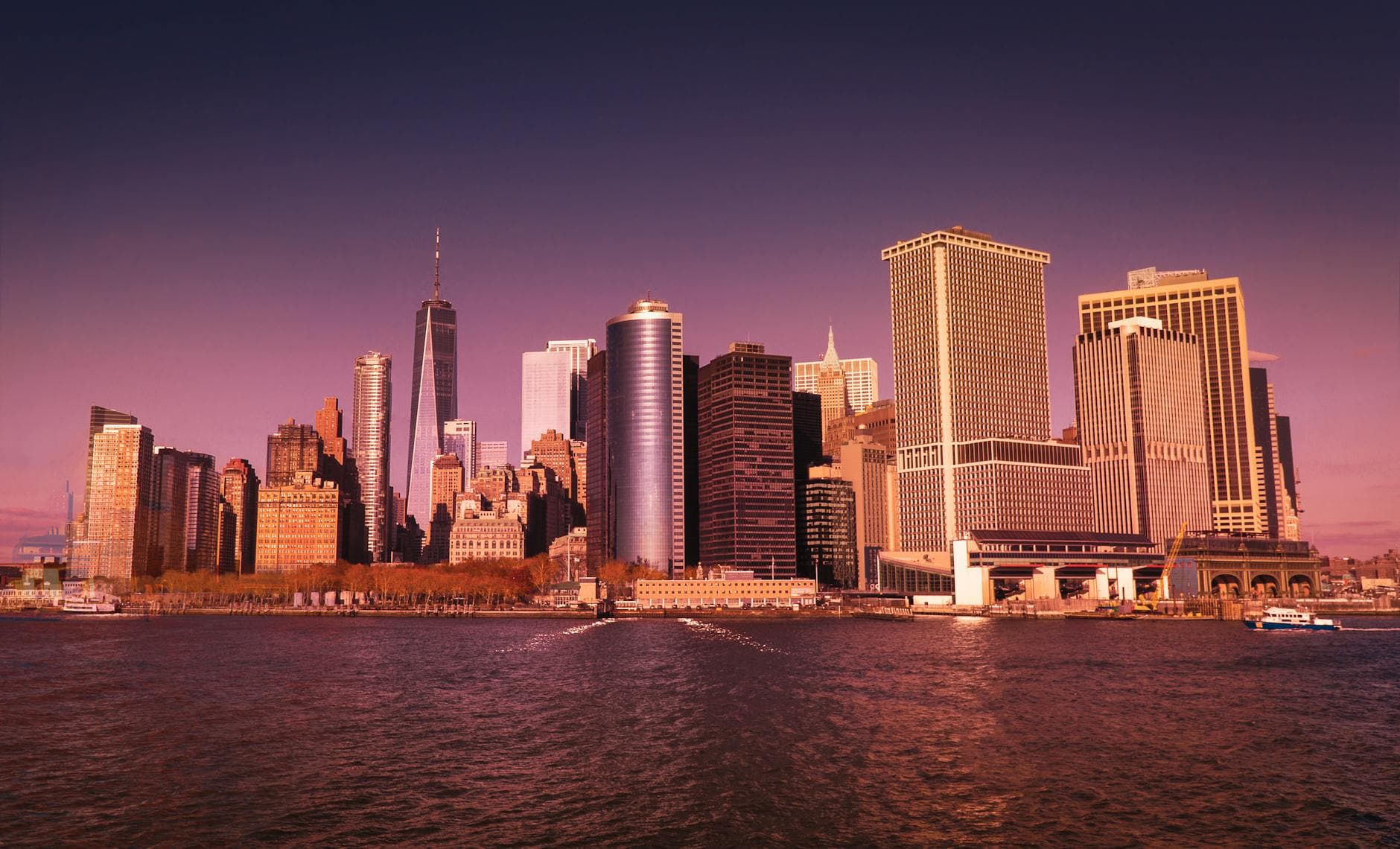 Beautiful view of New York City's skyline from the waterfront during sunset.