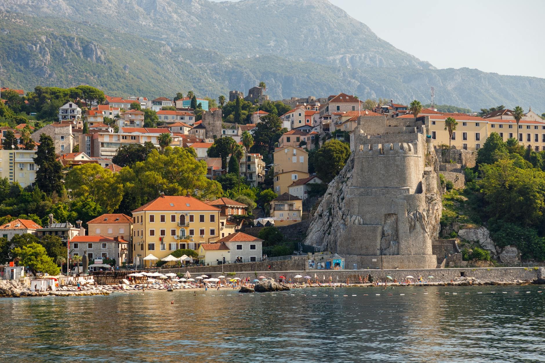 Breathtaking view of Herceg Novi featuring the Kanli Kula Fortress and vibrant coastline.