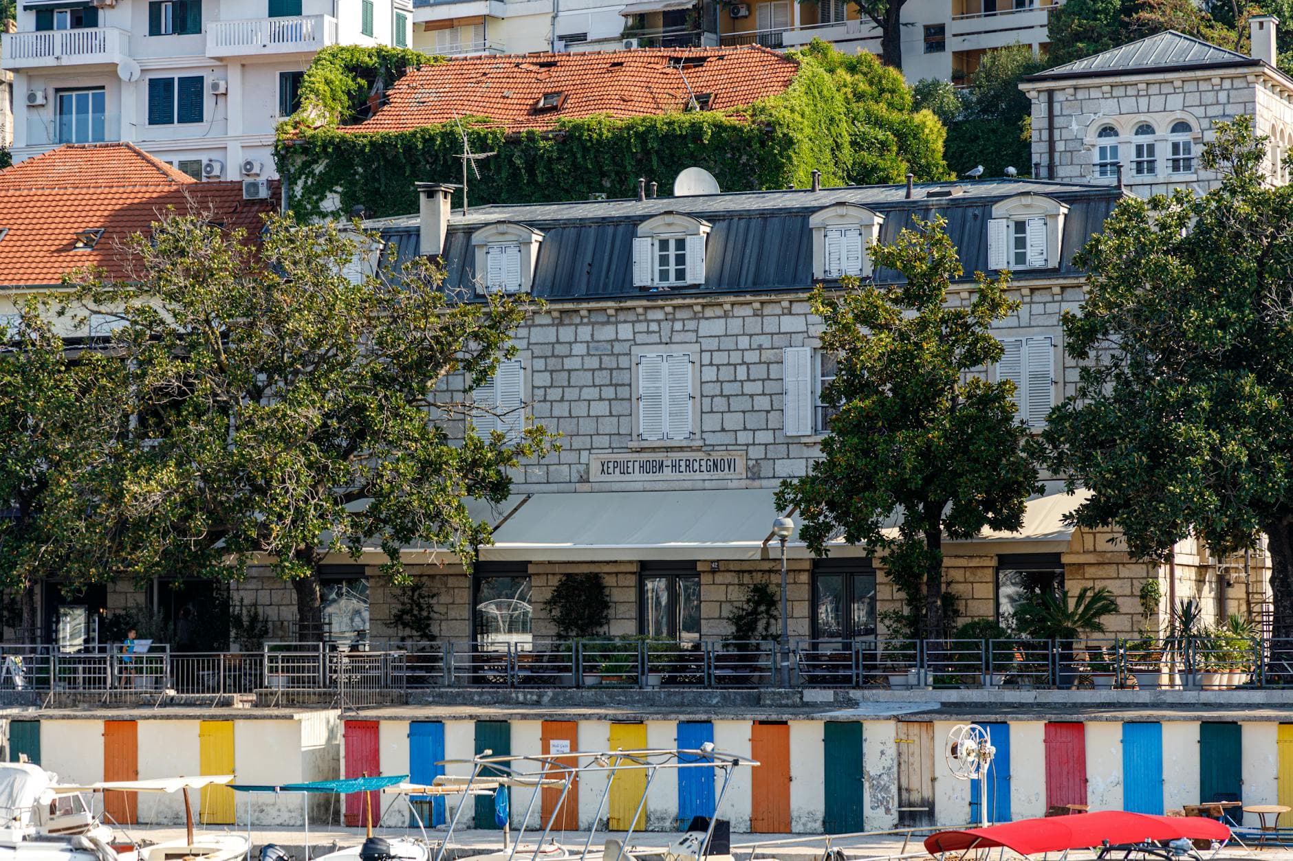 Picturesque view of a historic building by the waterfront in Herceg Novi, Montenegro.