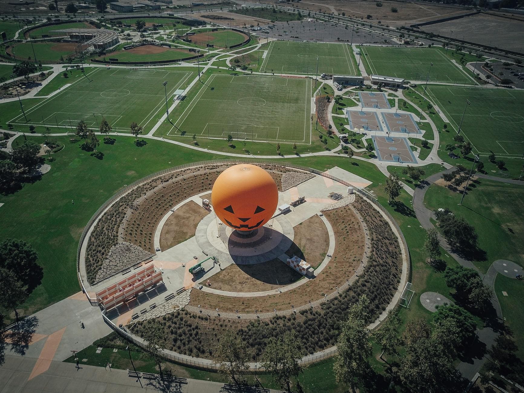 Aerial view of the iconic Great Park Balloon in Irvine, California, surrounded by greenery.