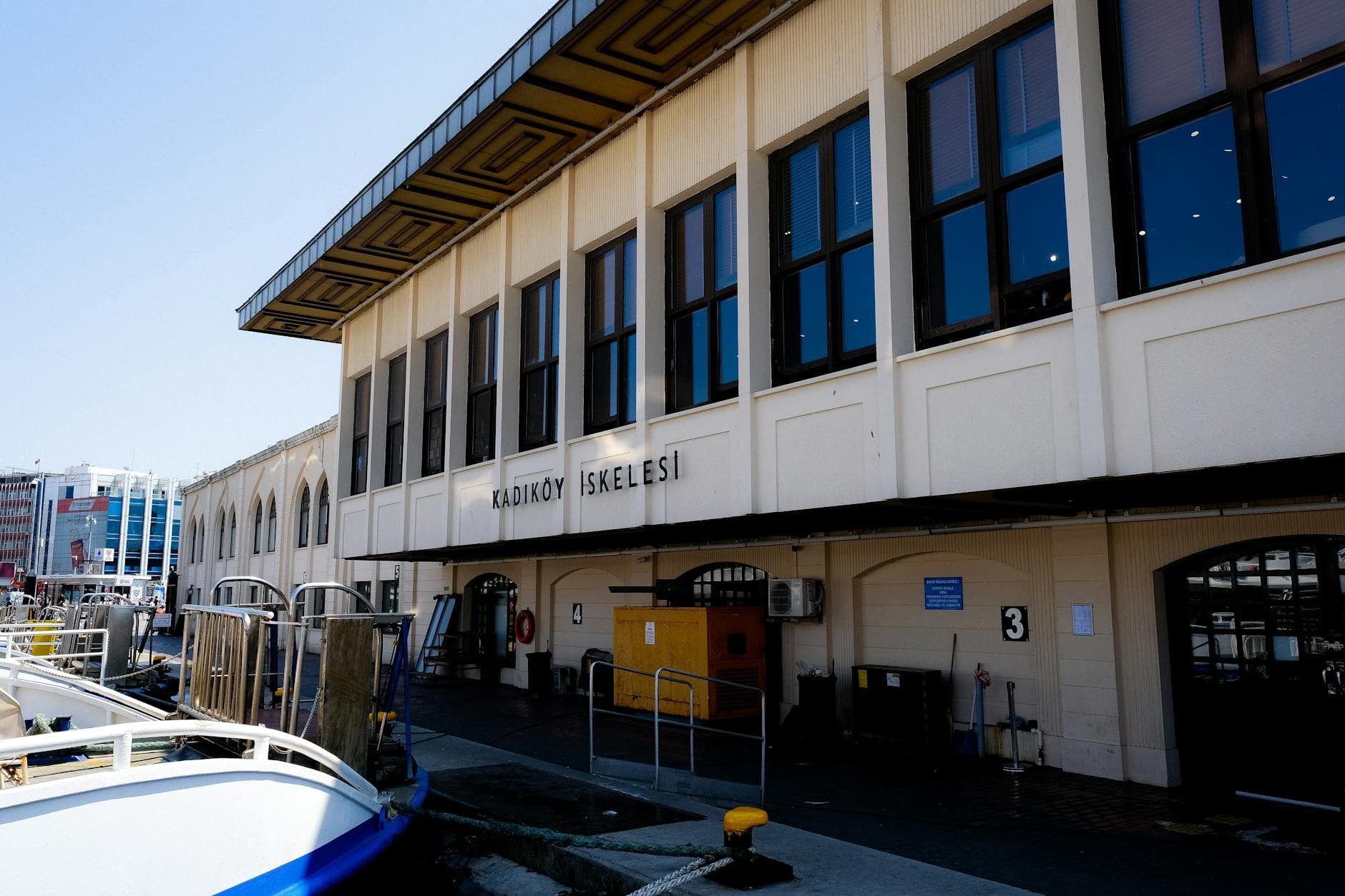 View of Kadıköy Iskelesi Ferry Terminal in Istanbul, highlighting vibrant urban maritime scenery.