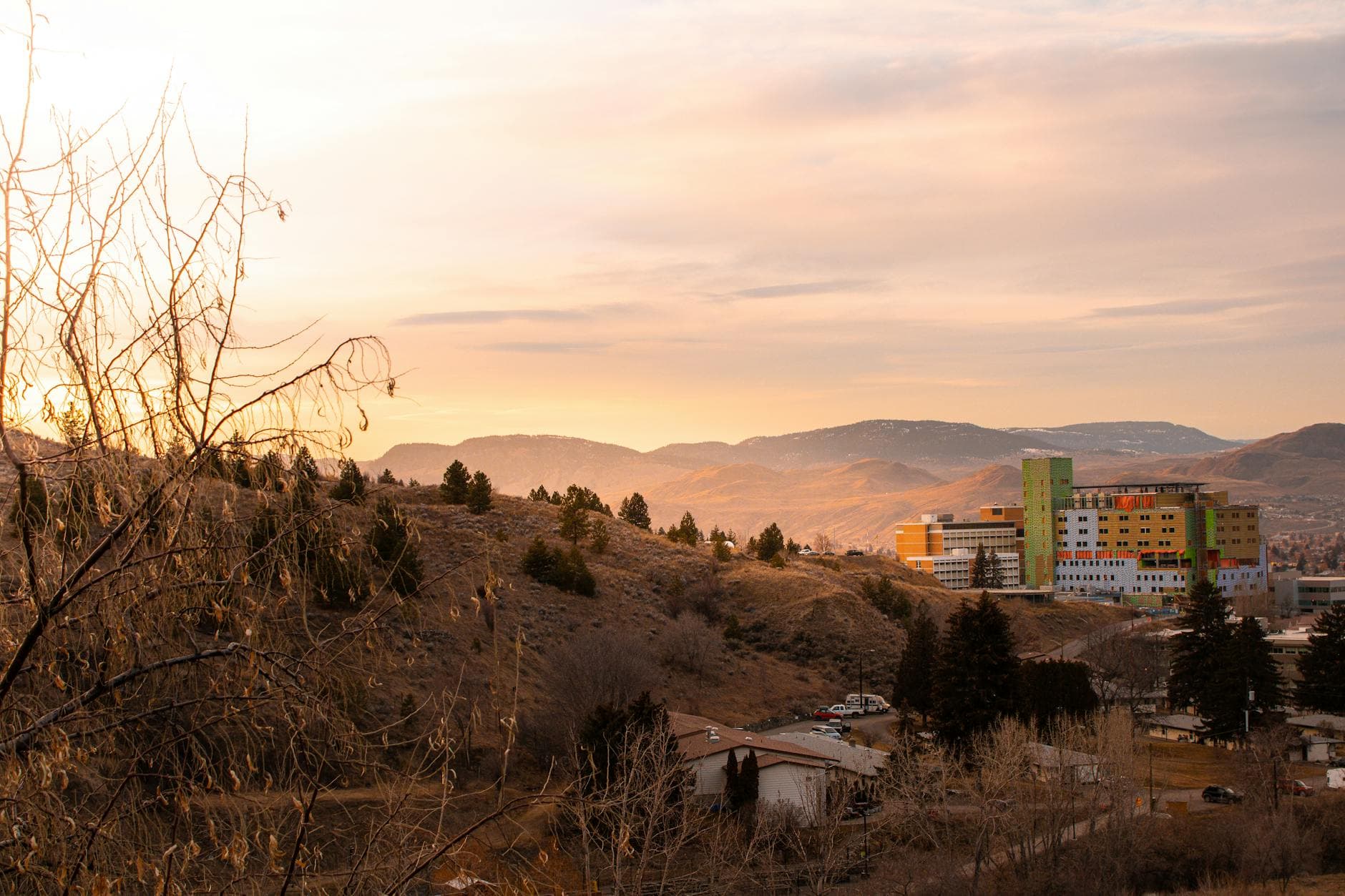 Beautiful sunset view over hills and urban buildings in Kamloops, BC, Canada.