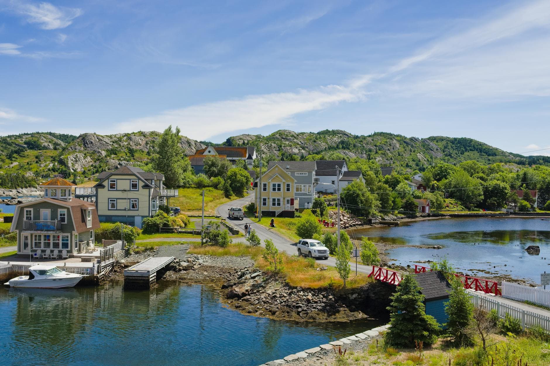 Scenic view of Brigus, a charming coastal village in Newfoundland, Canada, with colorful houses by the waterfront.