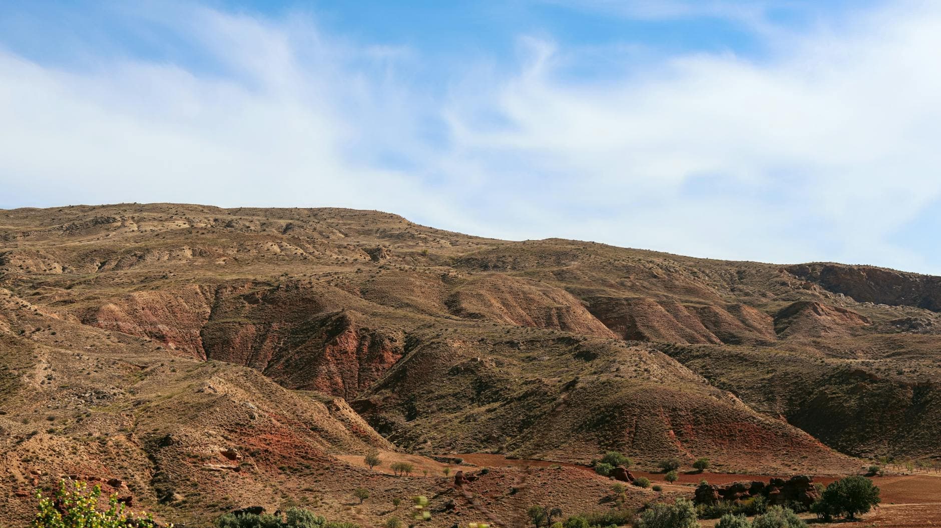 A breathtaking view of the rolling hills in Delice, Kırıkkale under a bright blue sky.