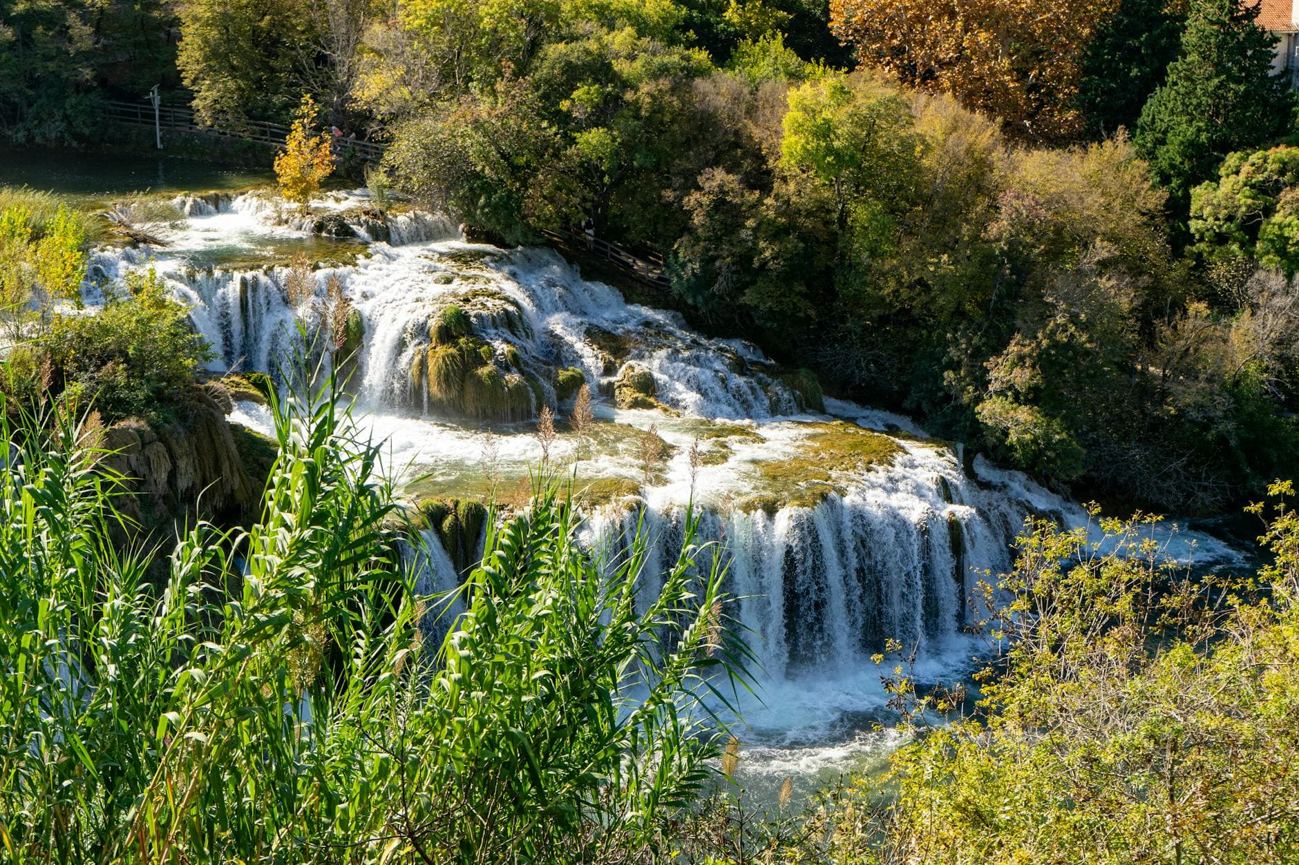 A picturesque view of waterfalls surrounded by lush greenery in Krka National Park, Croatia.