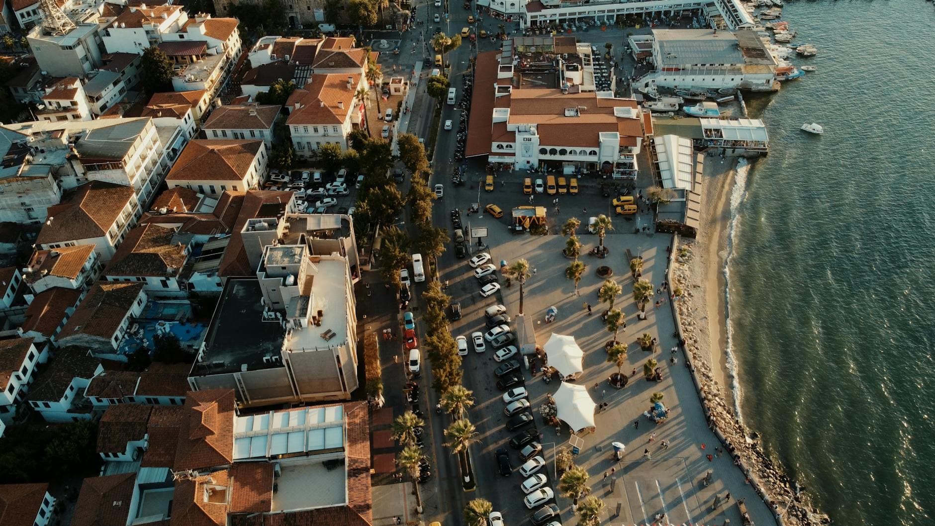 A stunning aerial view of Kuşadası waterfront, bustling with activity in the summer.