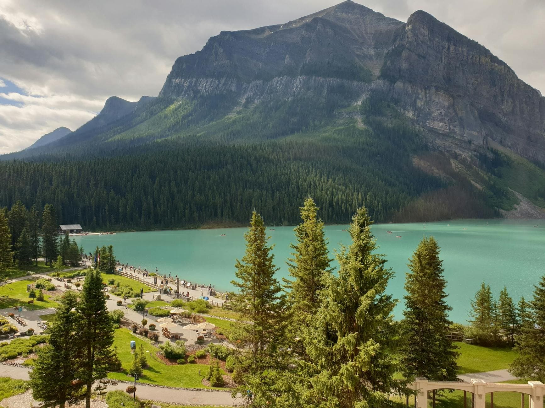 Breathtaking view of Lake Louise and surrounding mountains in Alberta, Canada.