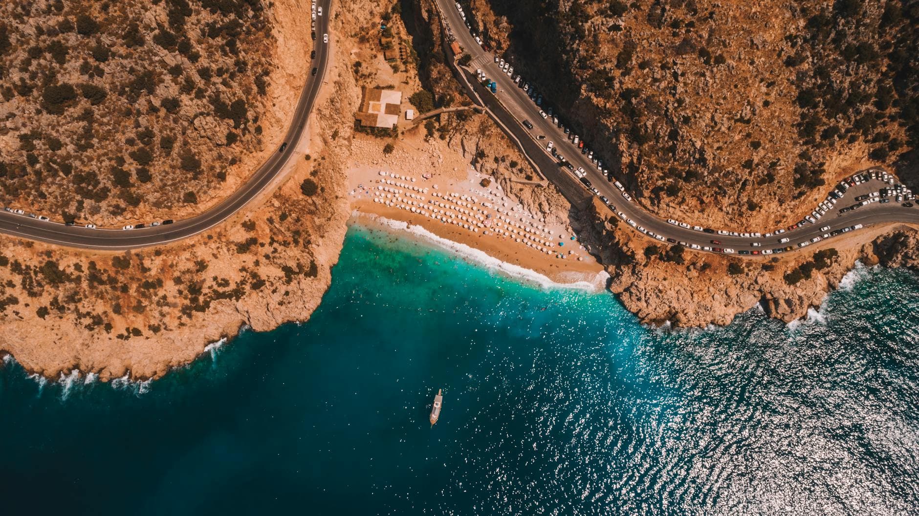 Stunning aerial view of Kaputaş Beach on the Antalya coastline, featuring turquoise waters and rocky cliffs.