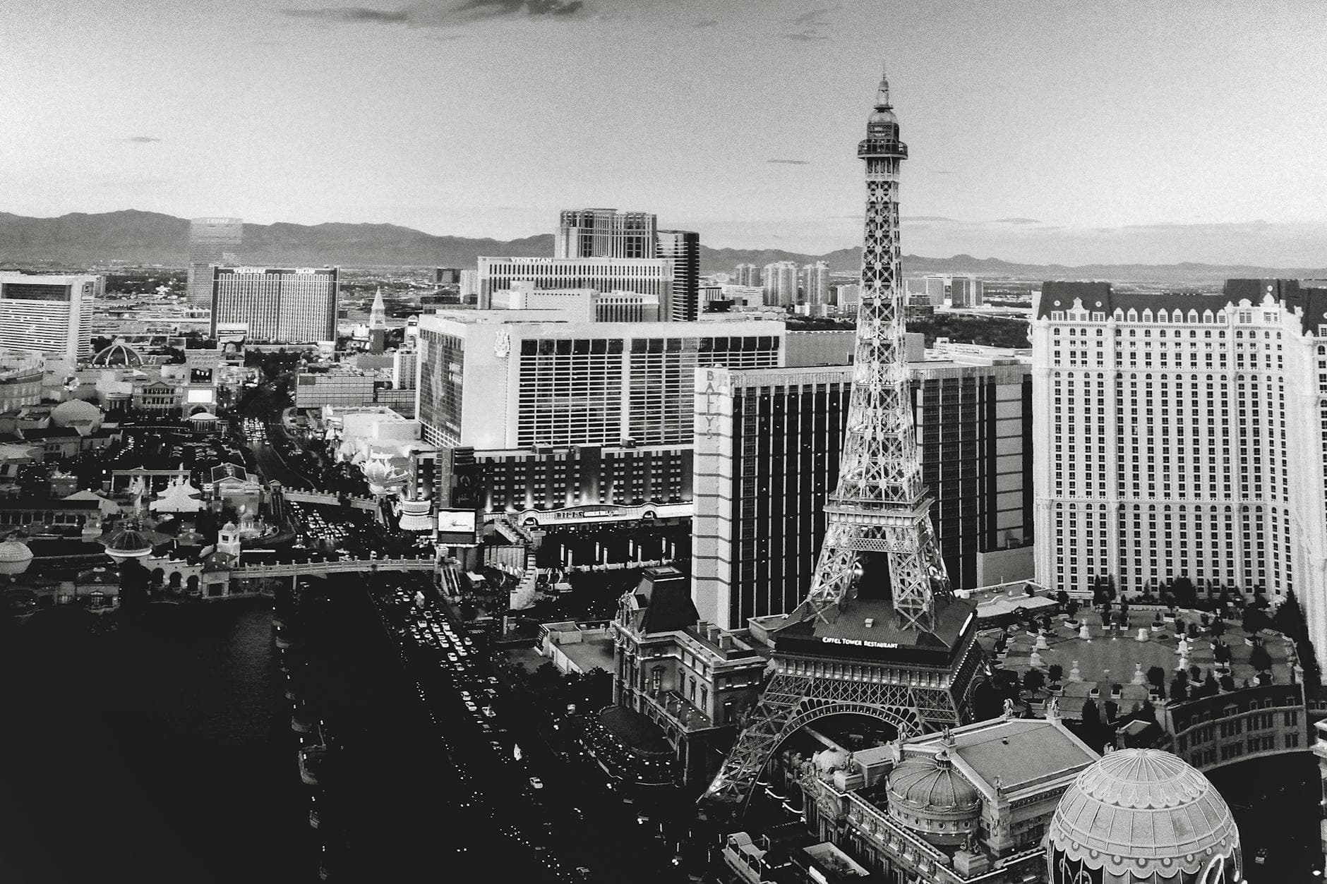 Black and white aerial shot of the Las Vegas skyline with replica Eiffel Tower.