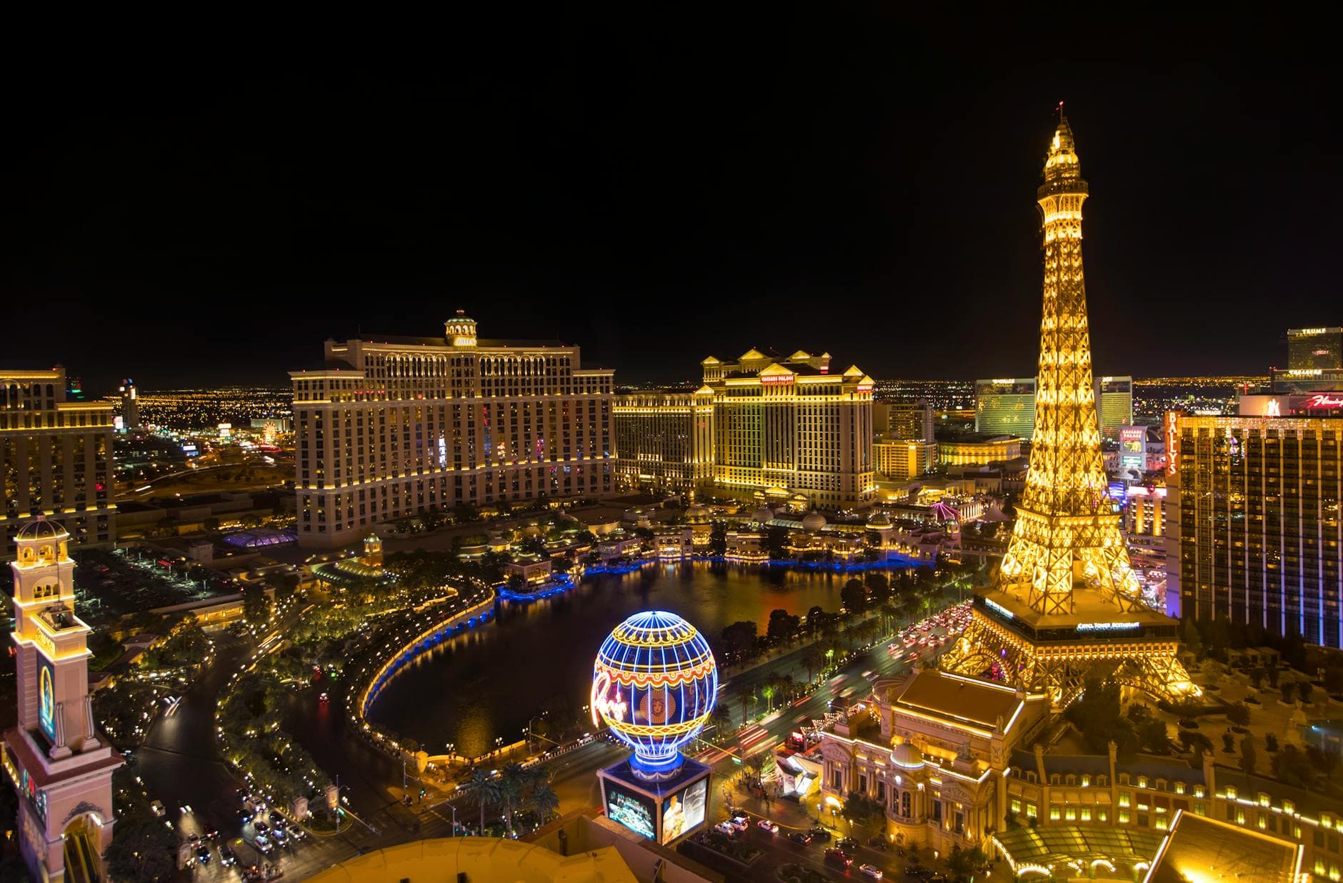 Stunning nighttime aerial view of the Las Vegas Strip featuring the Eiffel Tower replica.