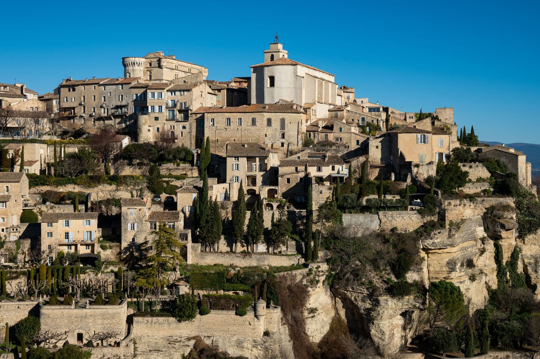 Captivating view of the historic village of Gordes nestled in the Provençal landscape, France.