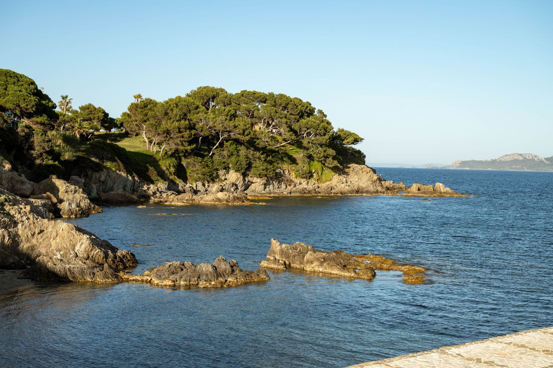 Stunning view of rocky coastline and clear blue sea in Hyères, Provence.
