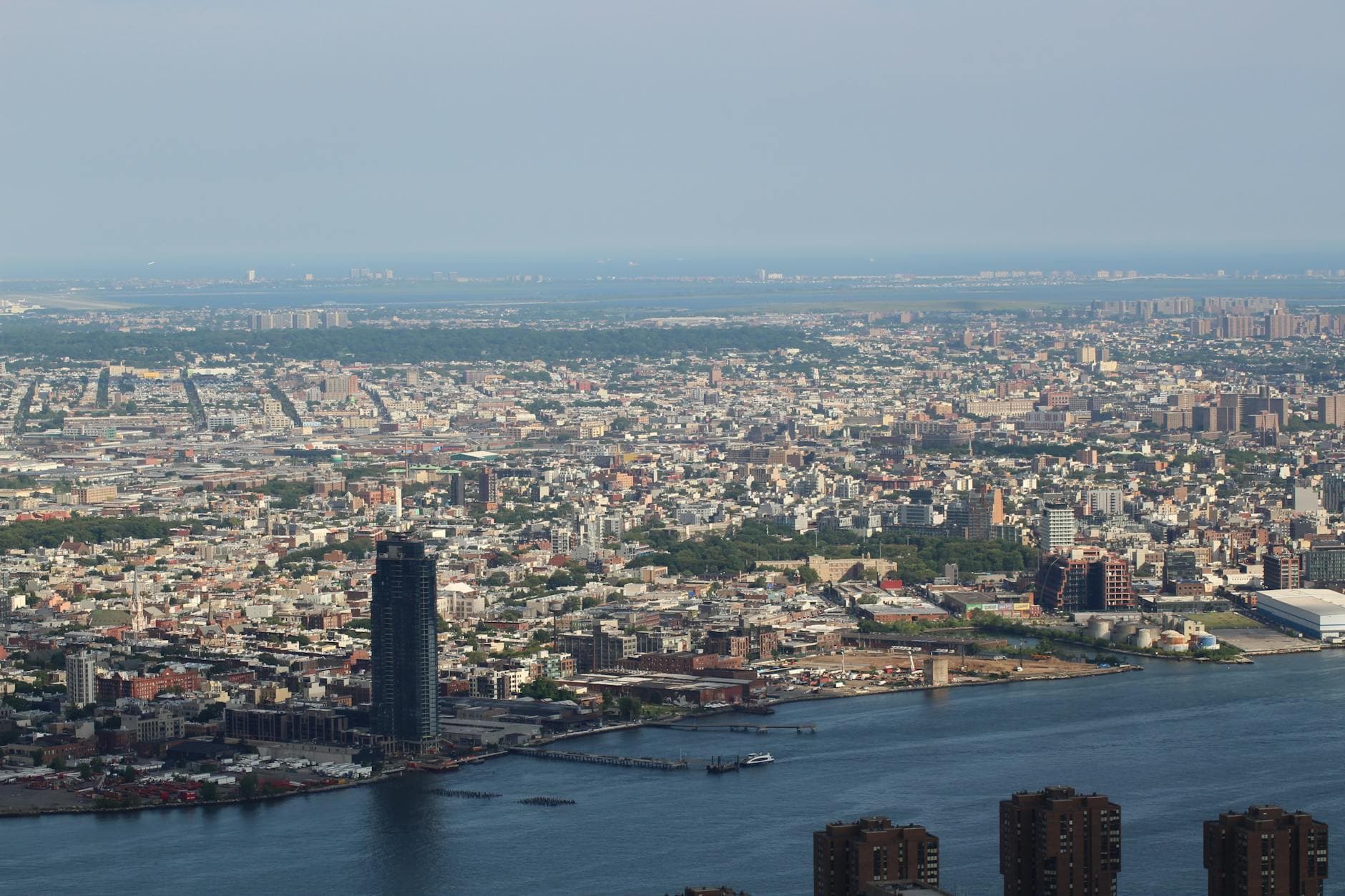 Aerial view capturing the expansive New York City skyline along the waterfront.