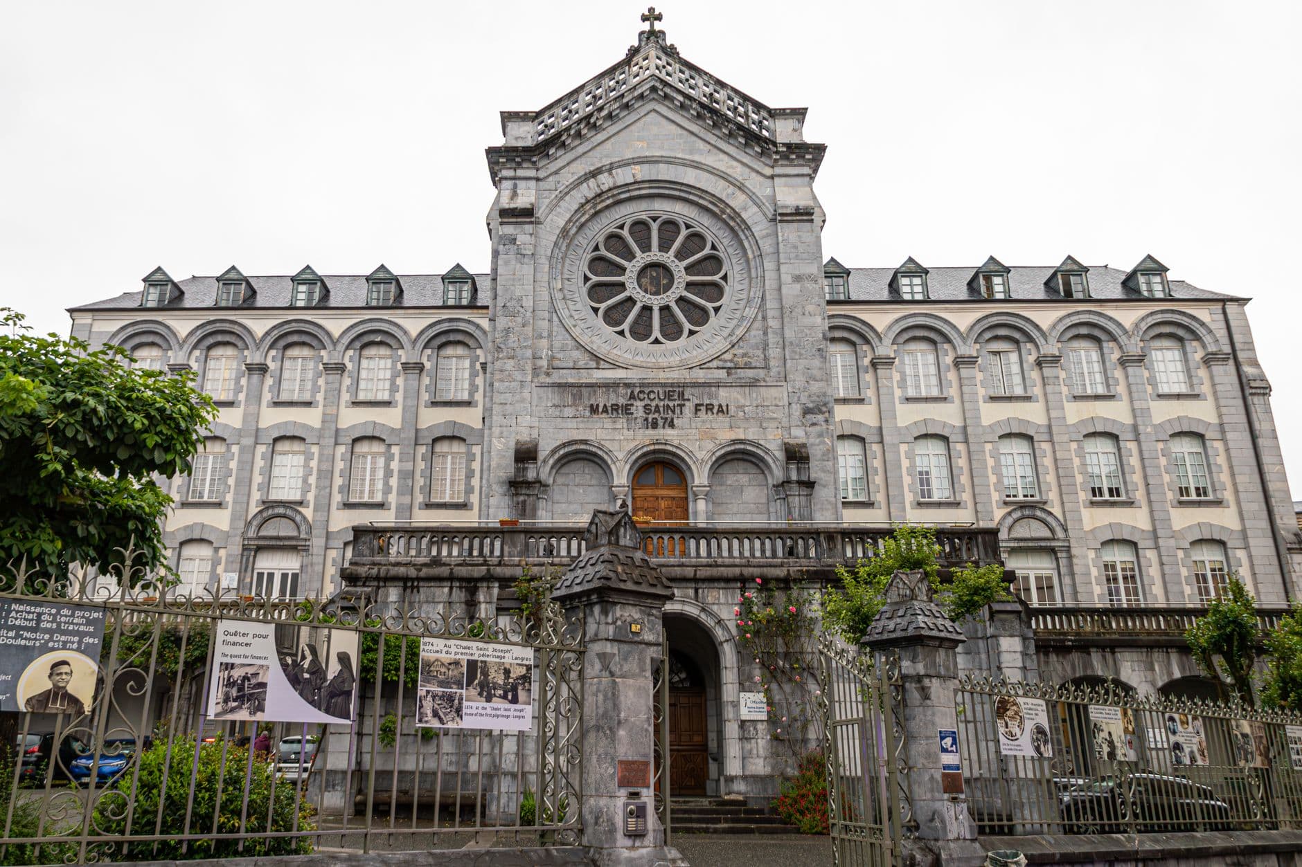 Front view of the Notre-Dame Basilica in Lourdes, showcasing its architectural grandeur.