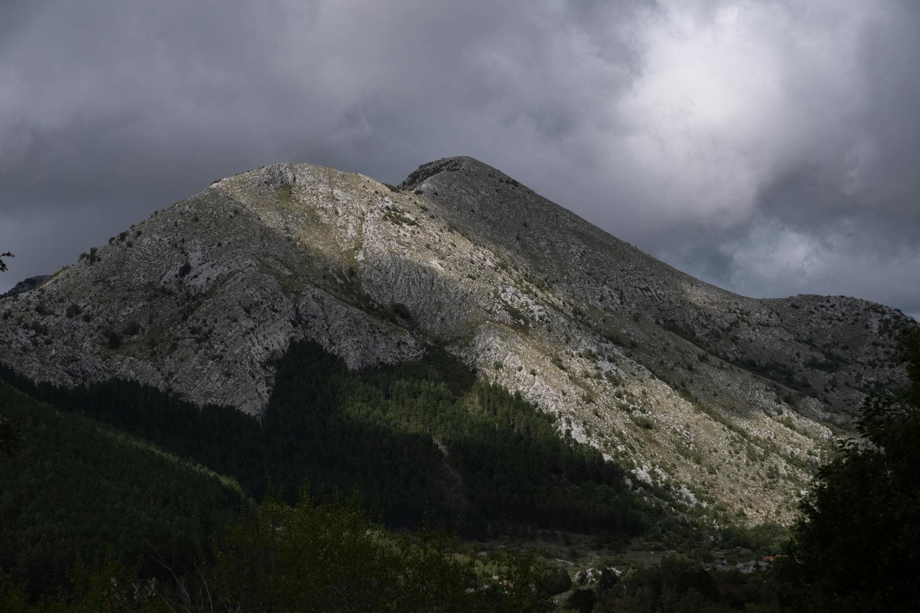 Scenic view of Lovcen mountain under a cloudy sky in Montenegro.
