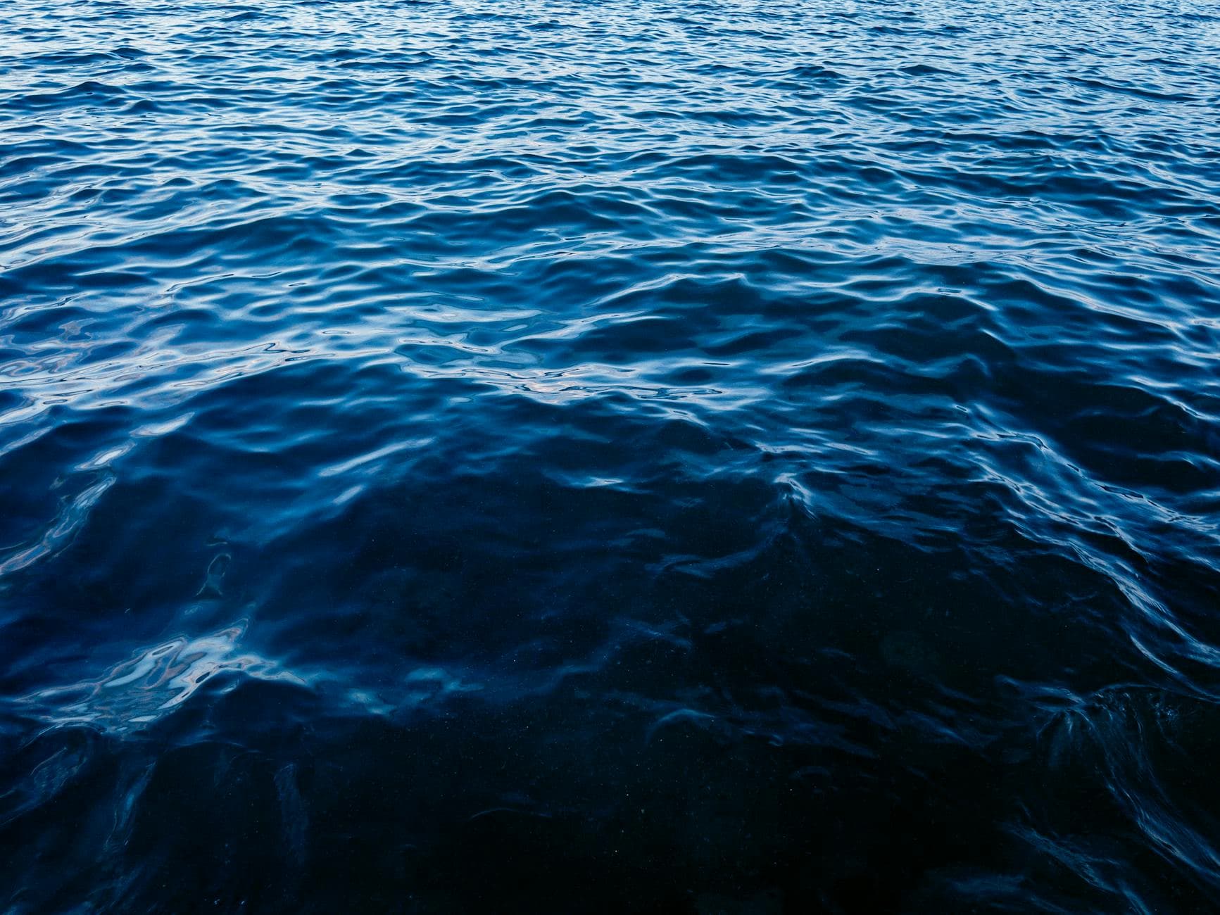 A peaceful view of the deep blue sea water at the beach in Alexandria, Egypt.