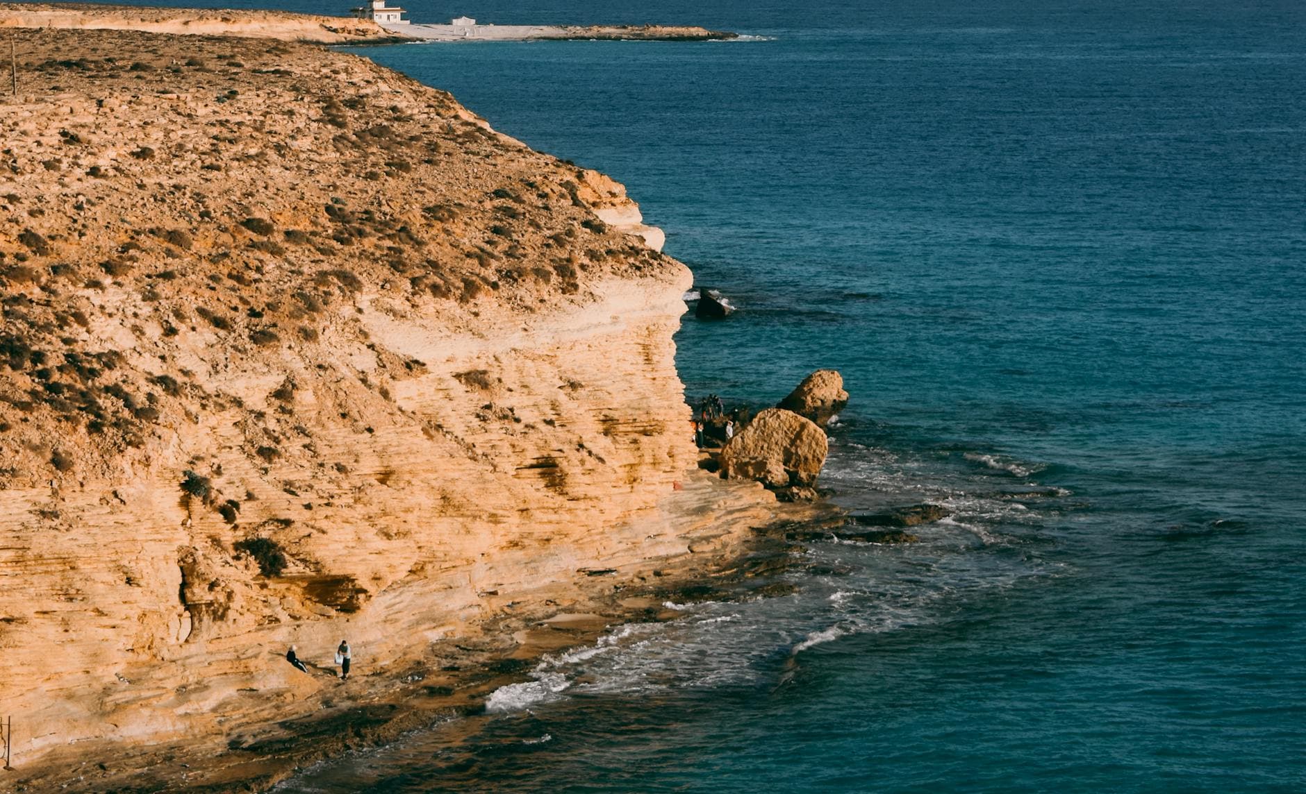 Explore the stunning coastal cliffs and clear blue waters of Marsa Matruh, Egypt.