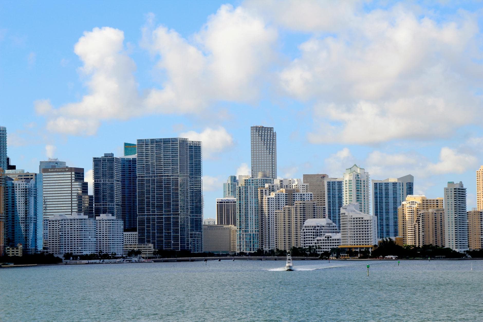 Captivating view of Miami's modern skyline and waterfront on a bright day.