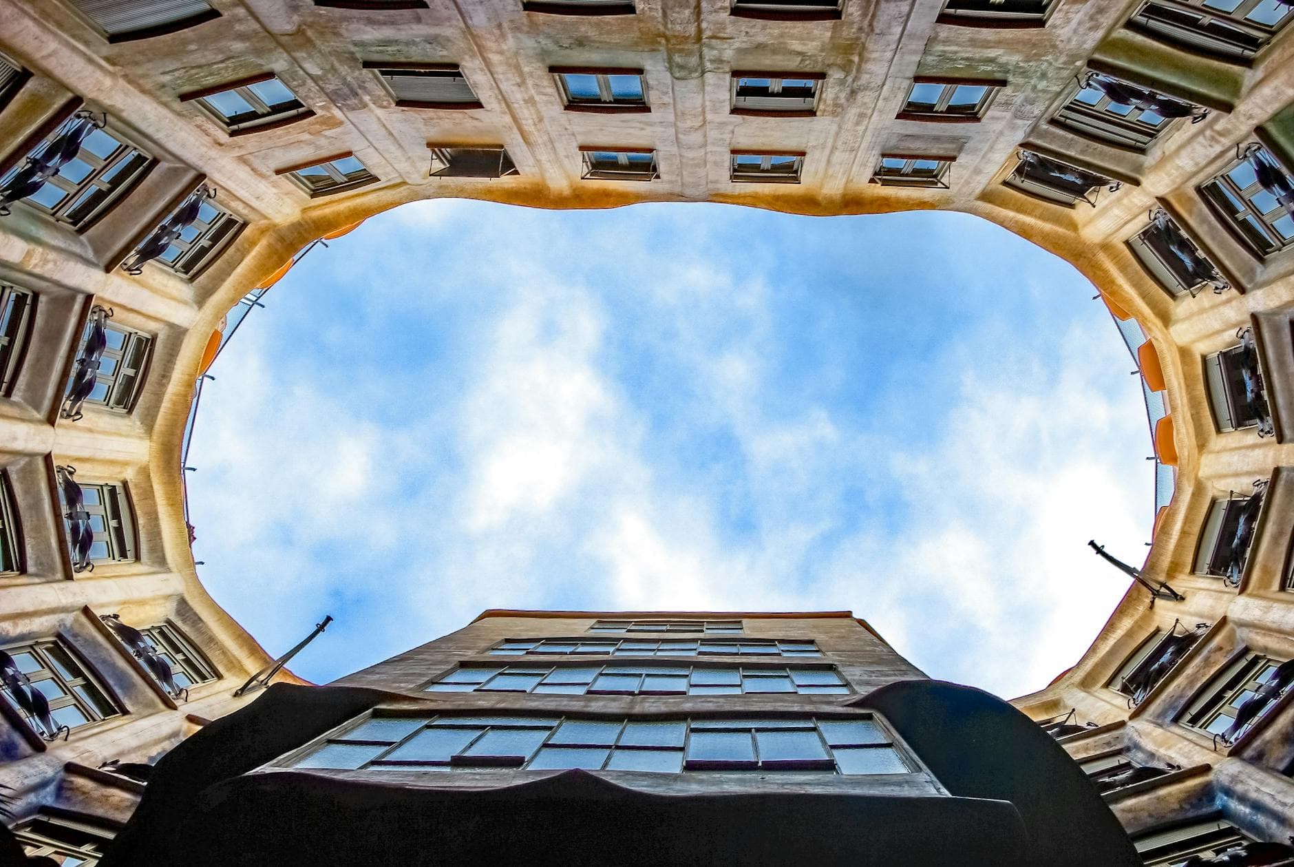 A striking view of Casa Milà's courtyard, showcasing Gaudí's iconic architecture in Barcelona.