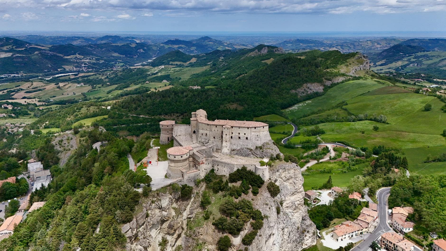 Scenic aerial photograph of the historic Forte di San Leo in Emilia-Romagna, Italy.