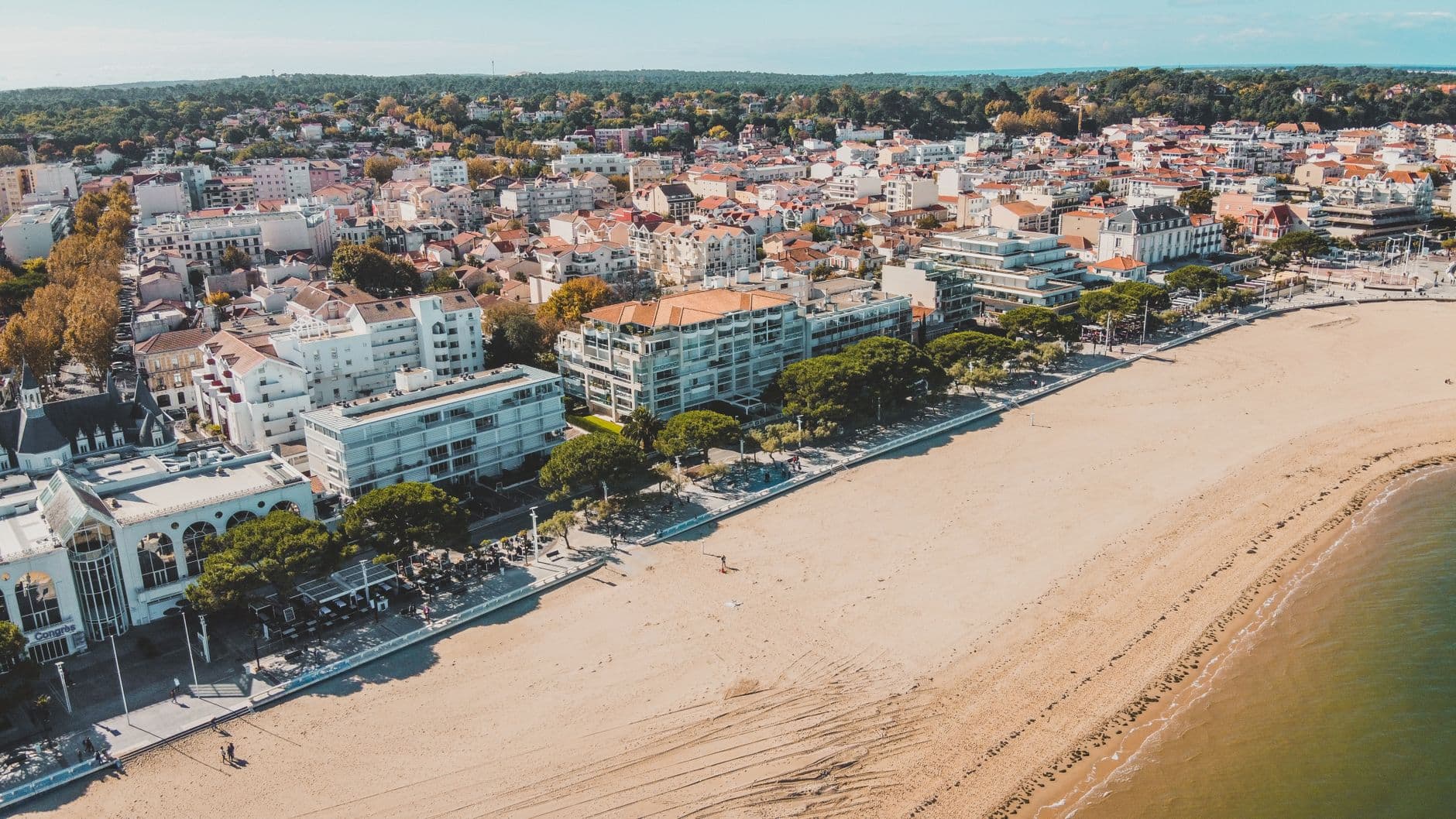 Stunning aerial view of Arcachon, France, showcasing the beach and vibrant cityscape.