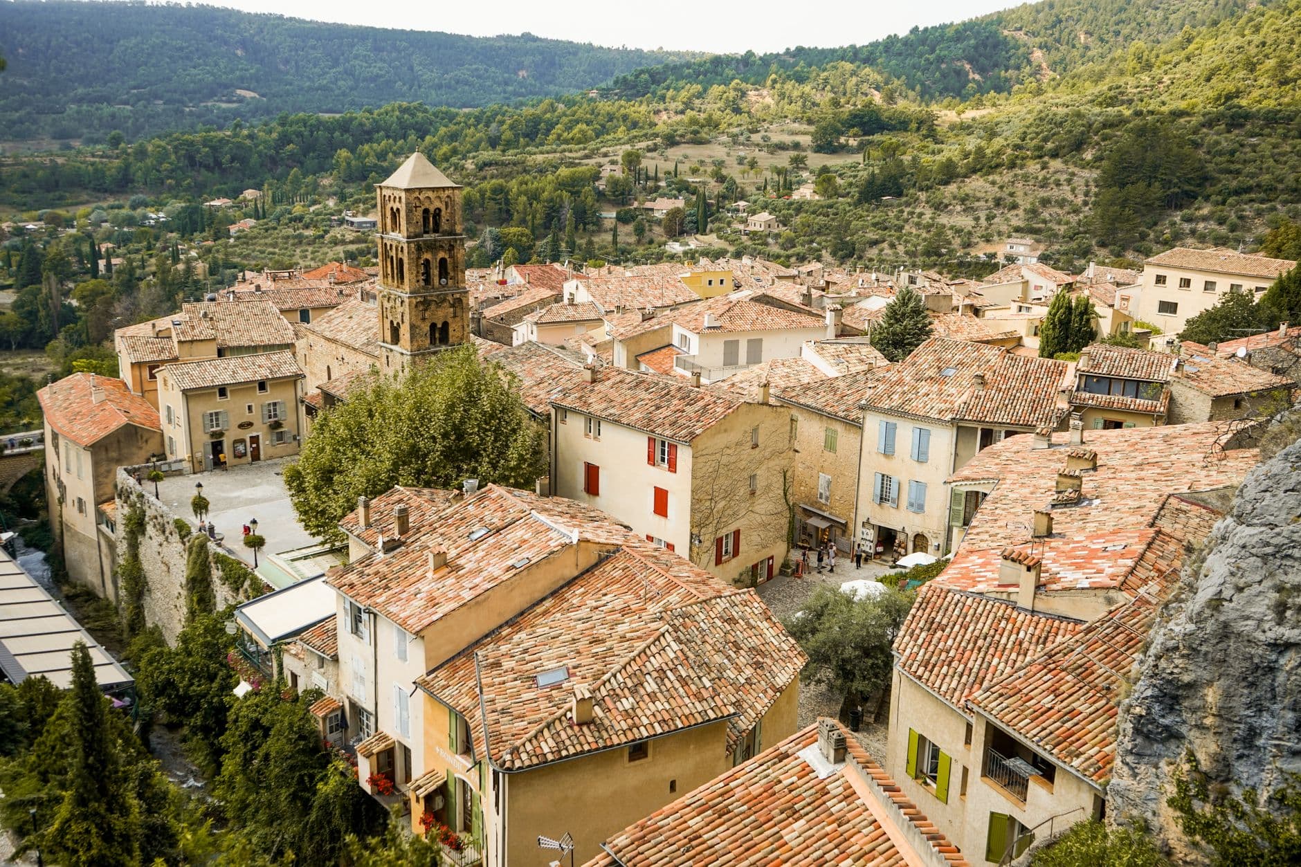Explore the picturesque rooftops and historic architecture of a French village in Provence.